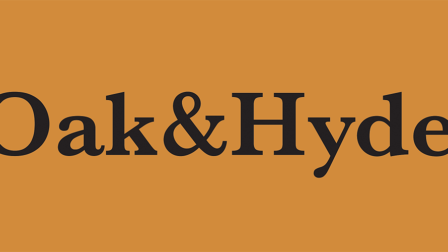 Oak & Hyde logo in black with orange brand colours background