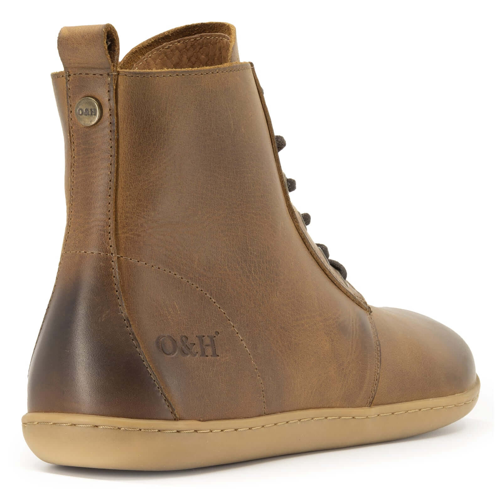 rear view of heel of cherry barefoot ankle boots in tan showing branding and heel pull tab