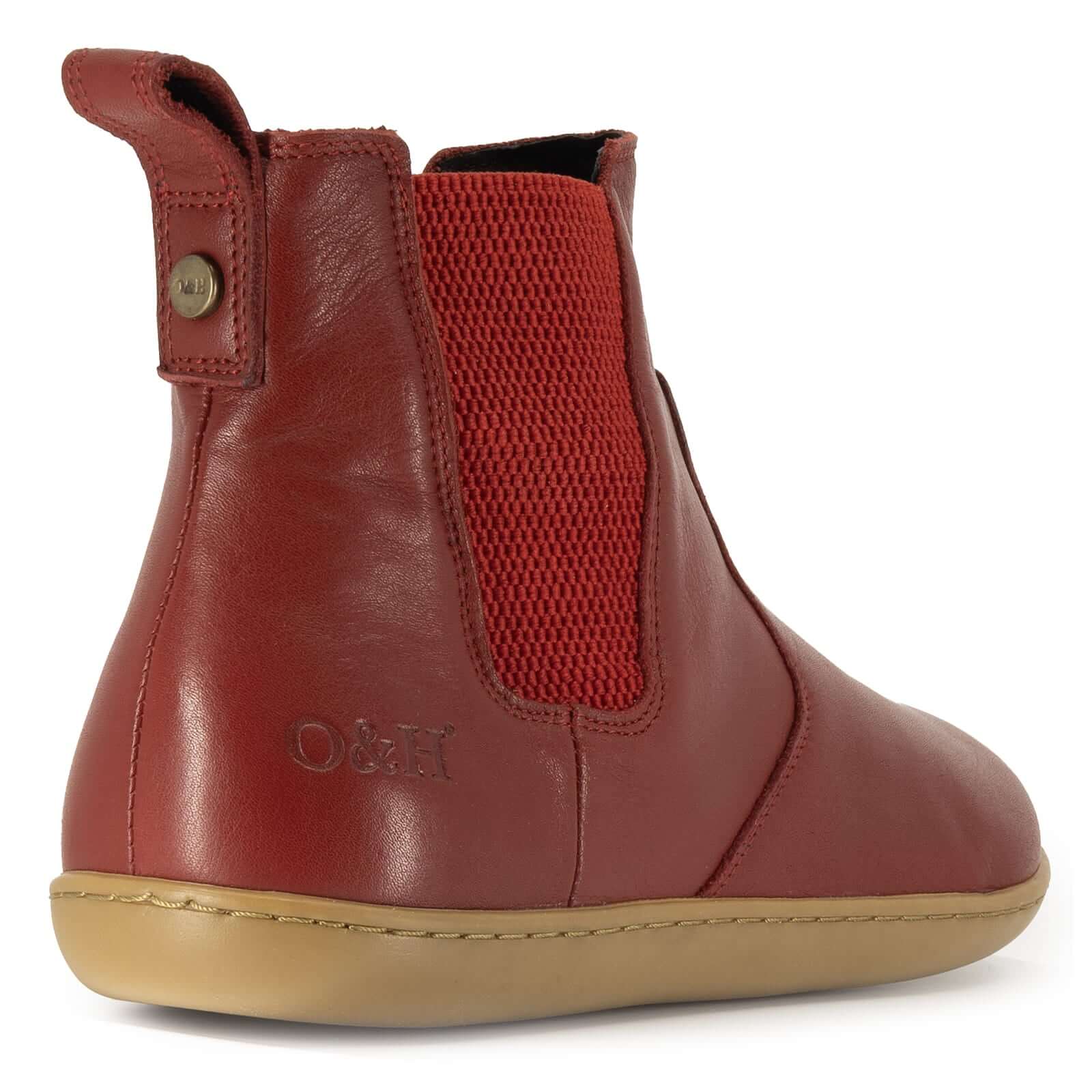 heel view of willow 2 red barefoot boots showing O&H brass pin and branding
