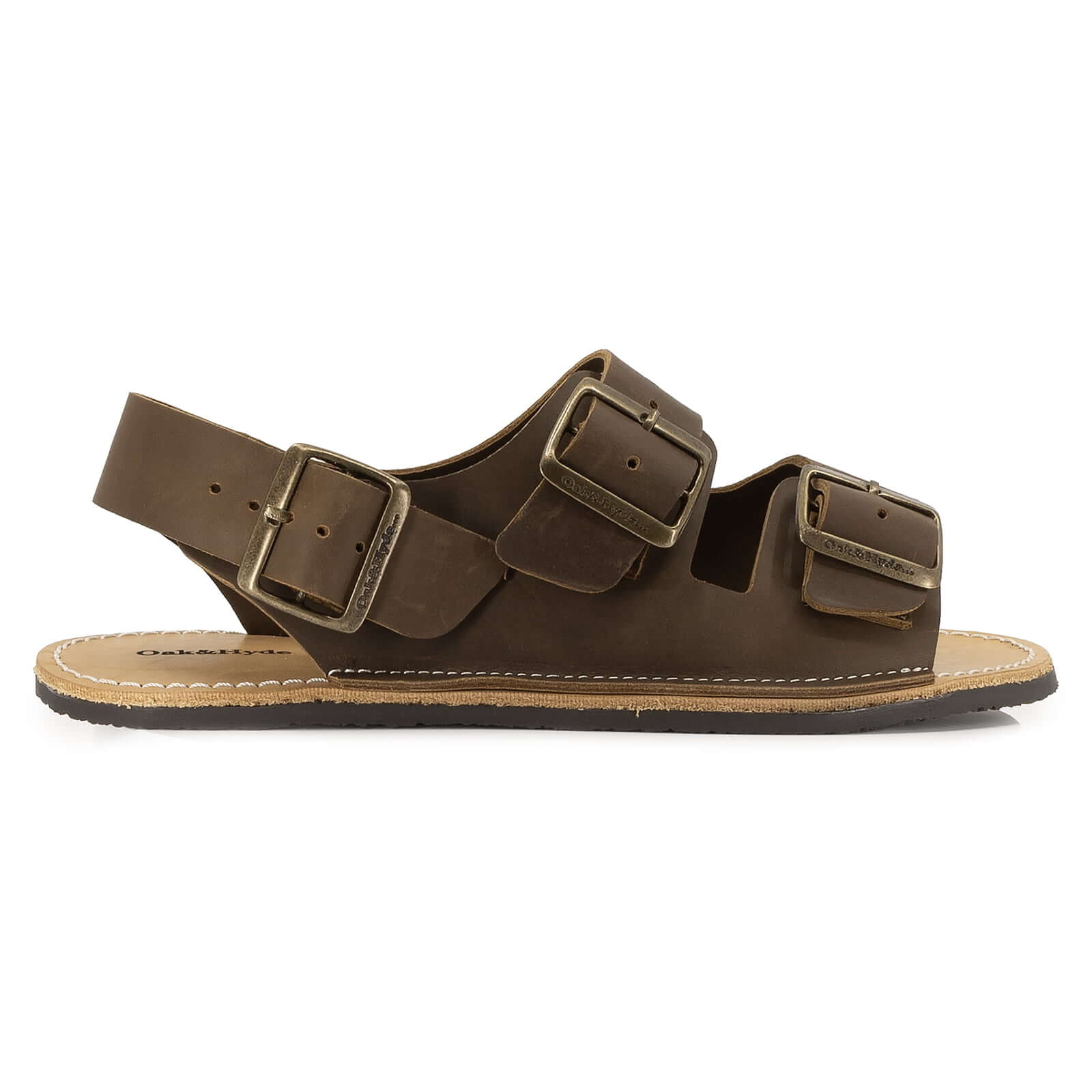 side profile view of mens acacia back strap barefoot sandals in brown showing buckle detail