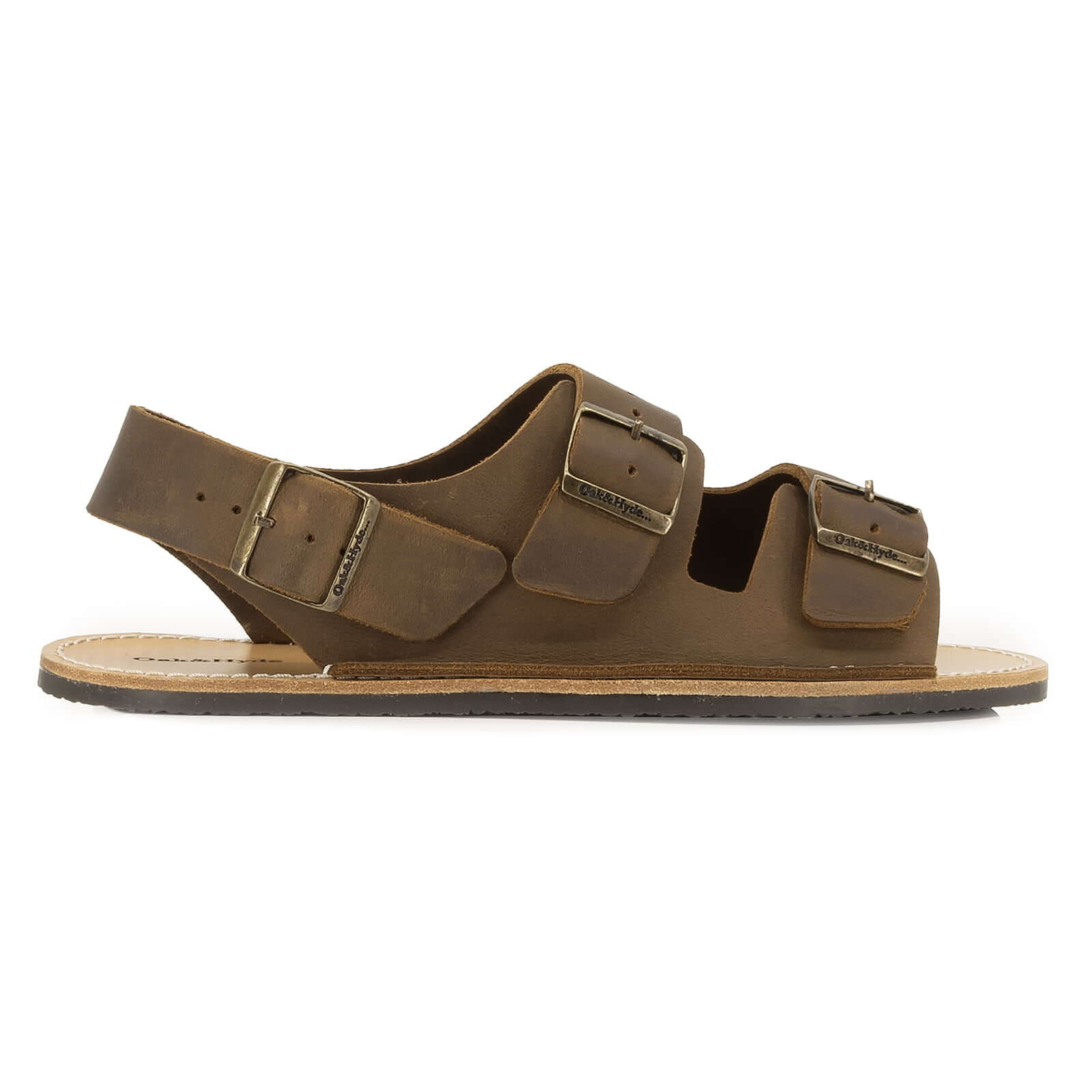 side profile view of mens acacia back strap barefoot sandals in brown showing buckle detail