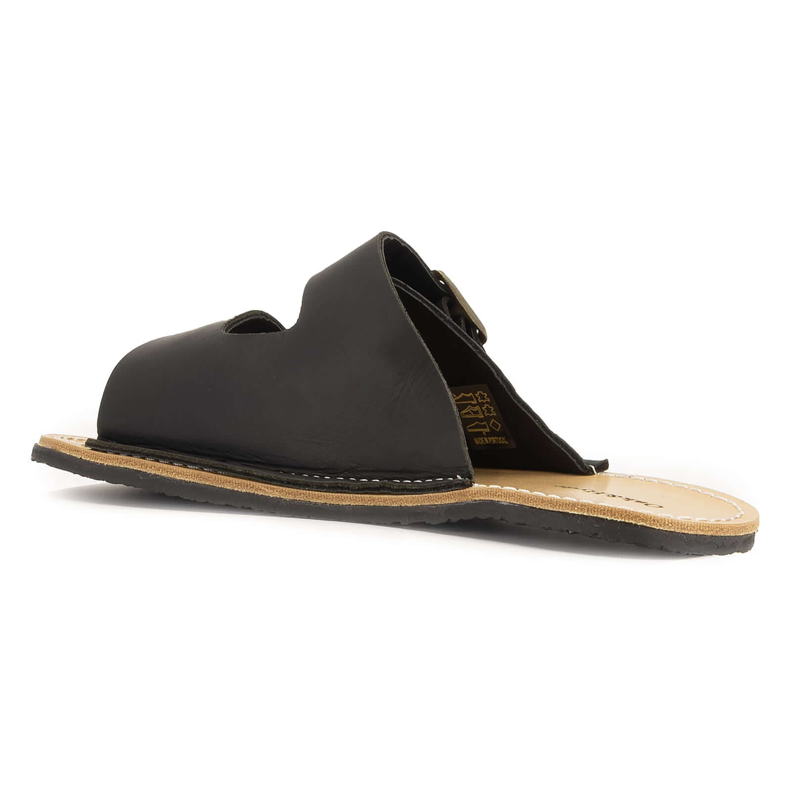 inside angled view of acacia barefoot sandals in black showing leather upper