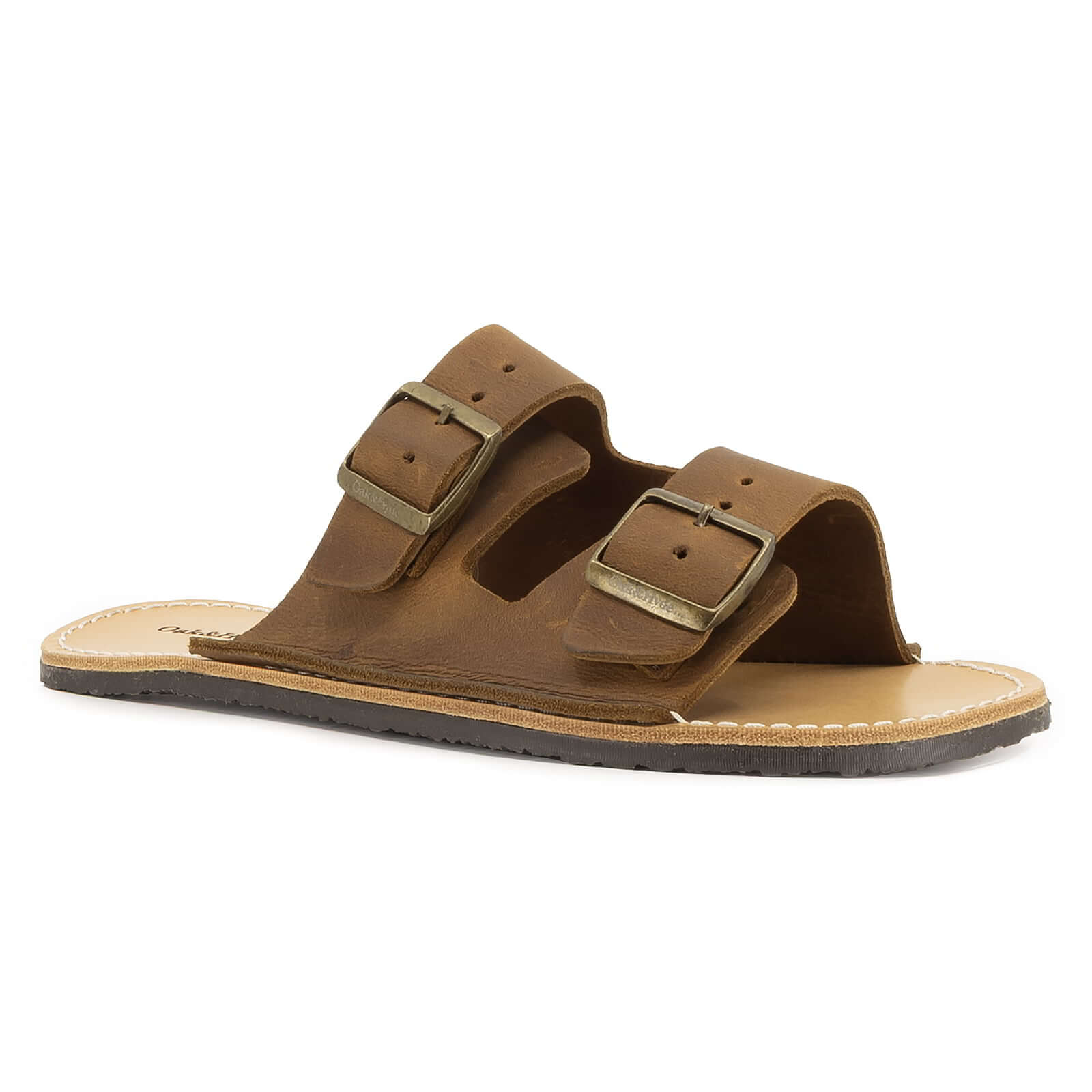 angles view of acacia barefoot sandals in brown showing an open toe an dopen back design