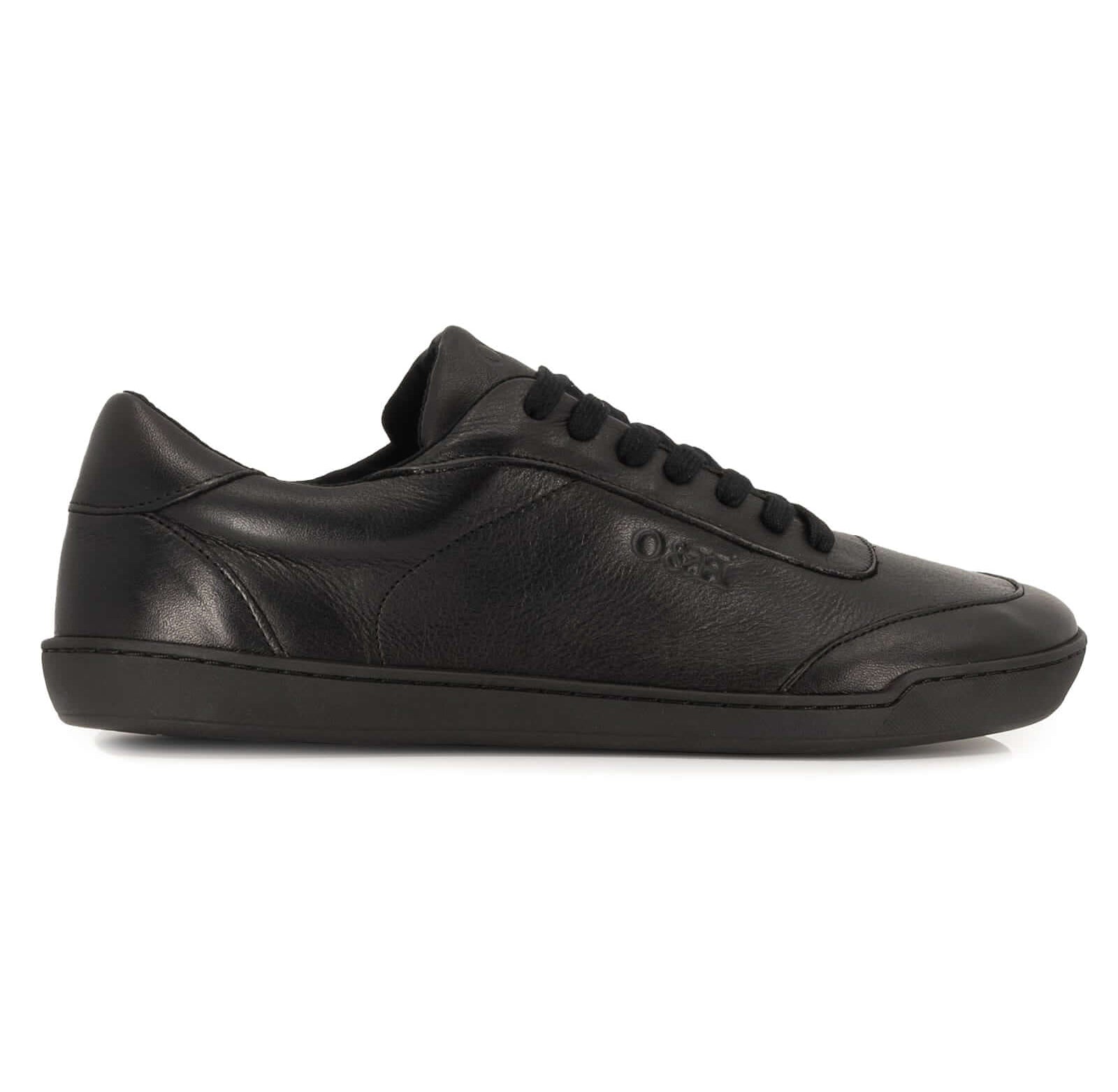 side profile view of all black leather barefoot trainers showing leather upper