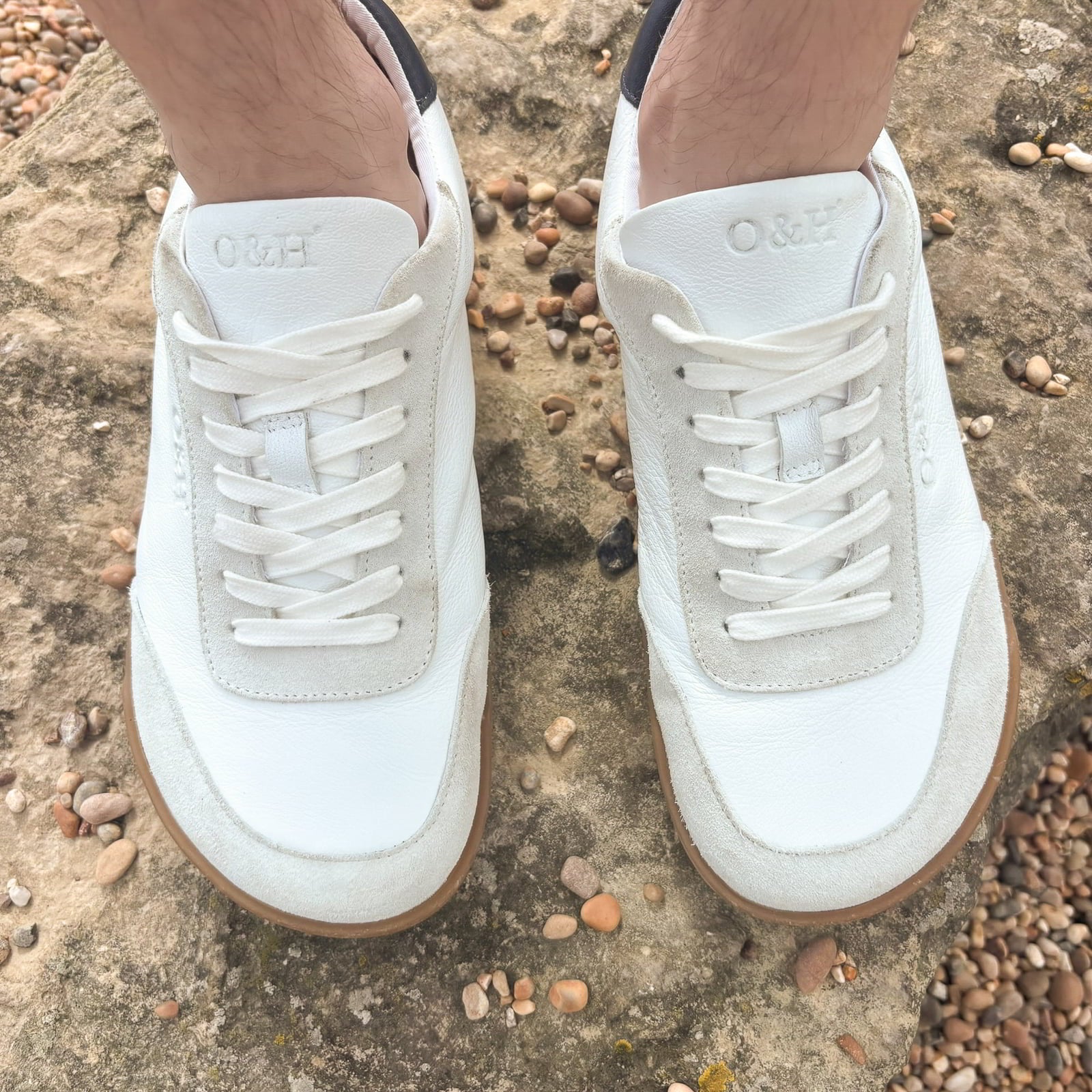 model wearing aspen barefoot trainers in white top down view showing toe shape