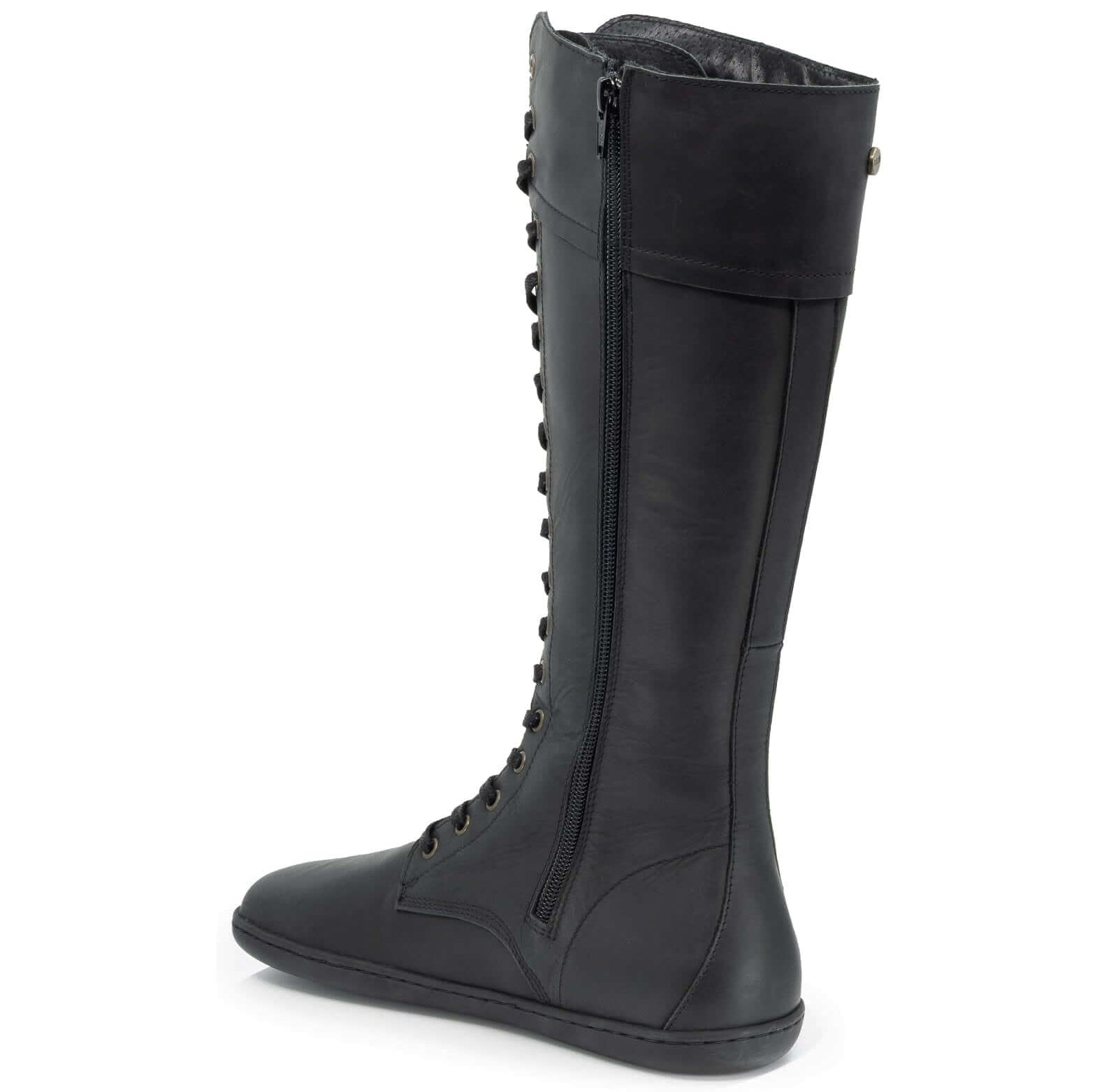 view of inside zip on tall black barefoot boots on white background