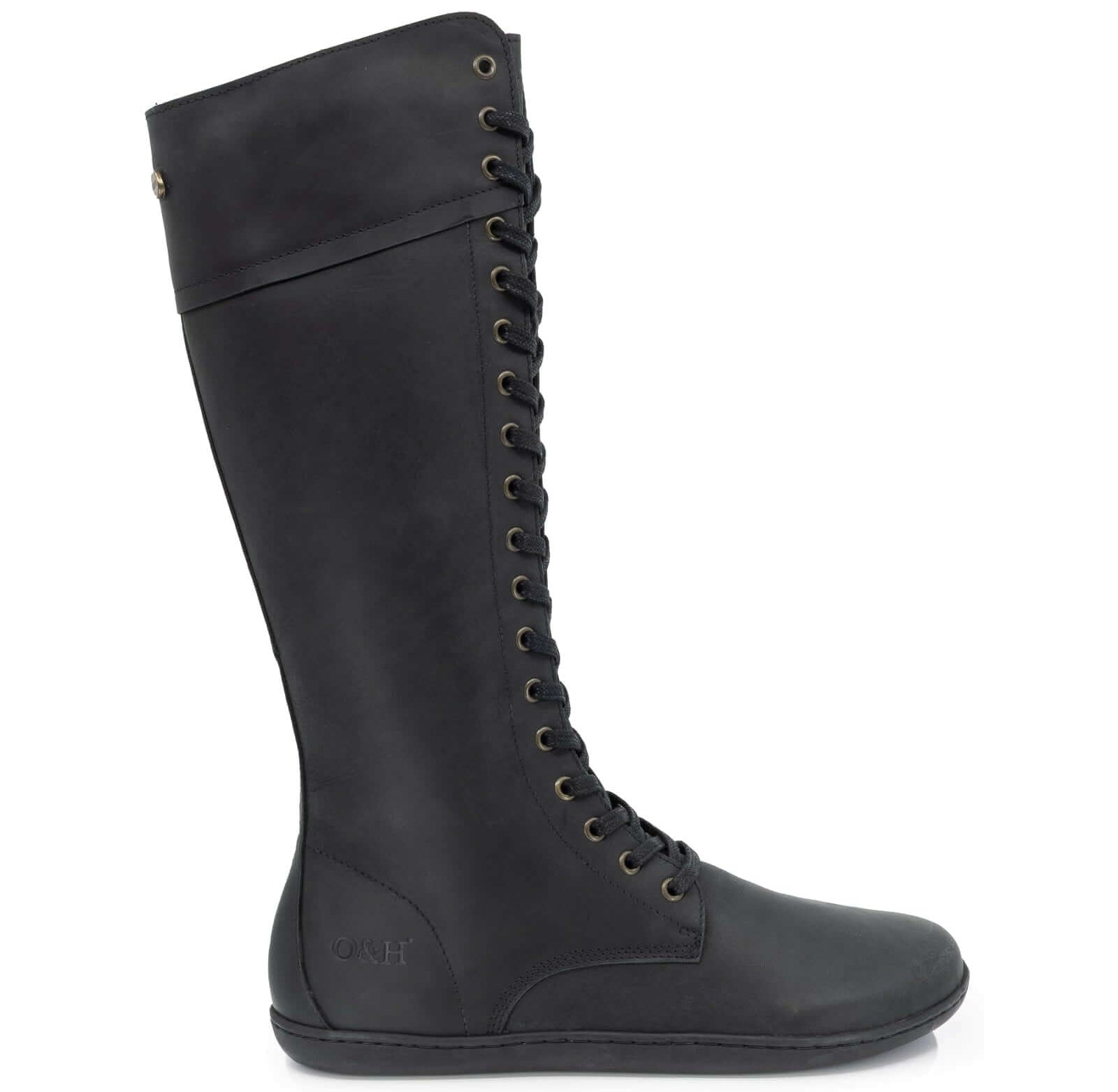 side view of tall lace up barefoot boots on white background