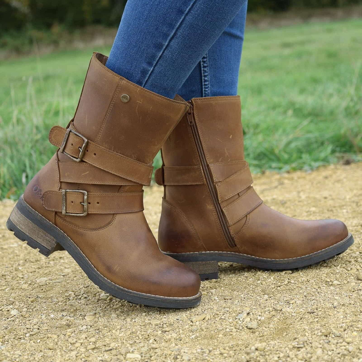 Cognac Bridge Demi 2 ankle boots worn with jeans outdoors on a gravel path