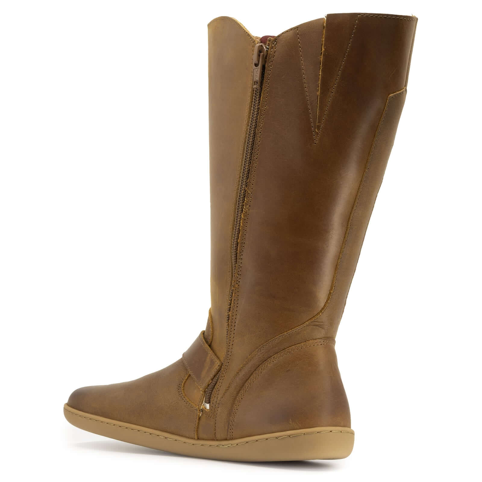 zip and leather upper of tan barefoot boots on white background