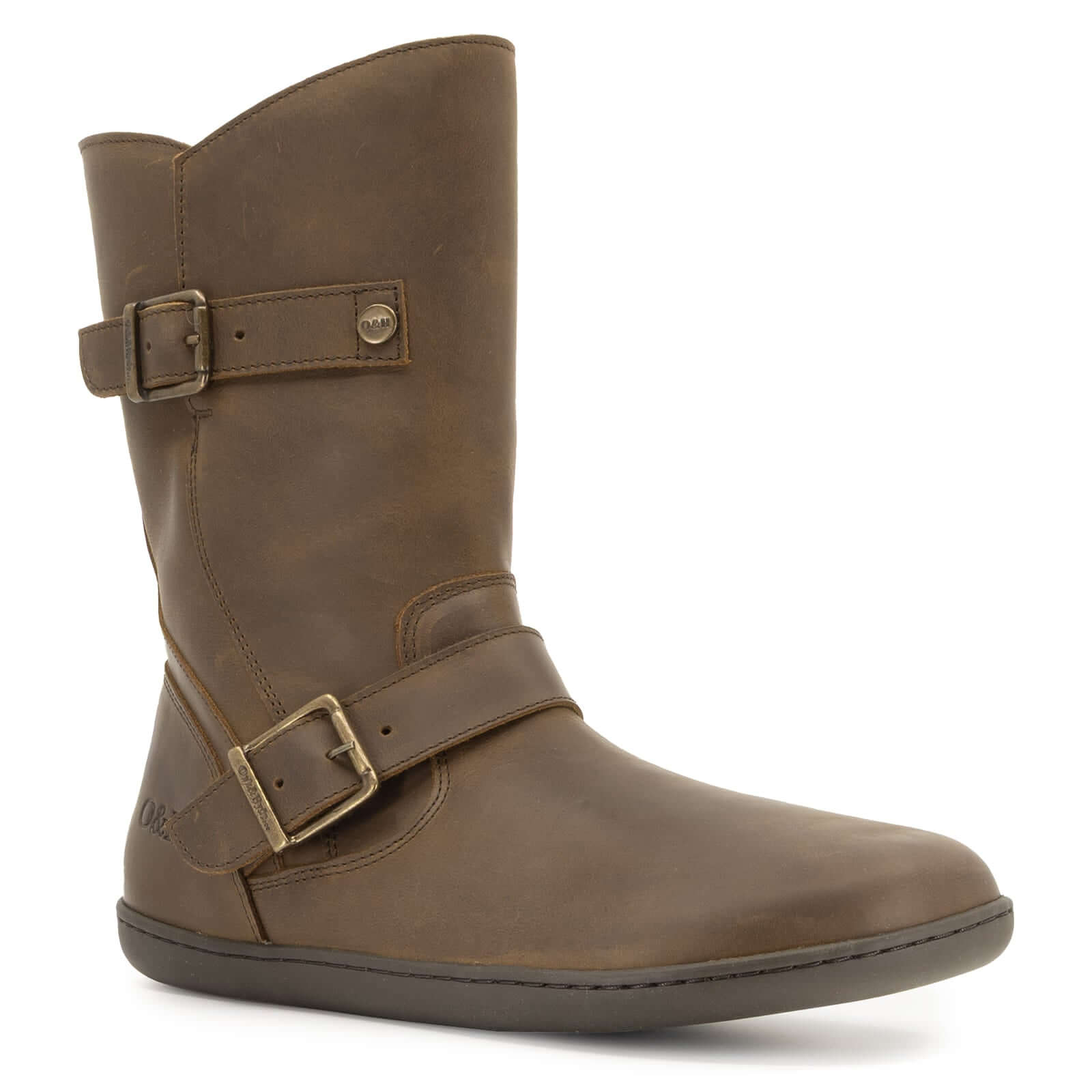 angled outside view of cedar demi barefoot boots in brown showing boot height and buckles
