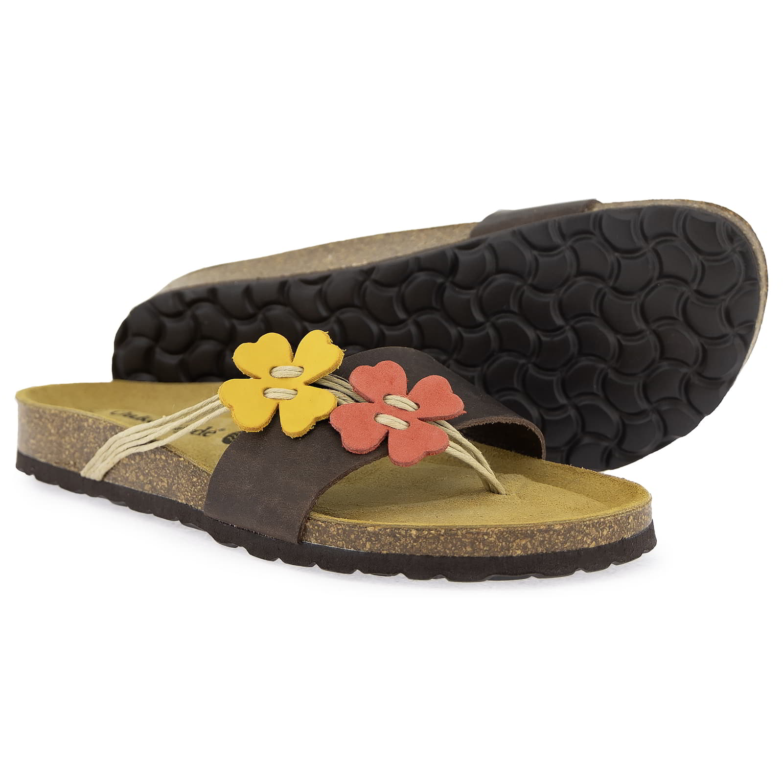 Outsole view of Clover brown sandal showing textured sole pattern