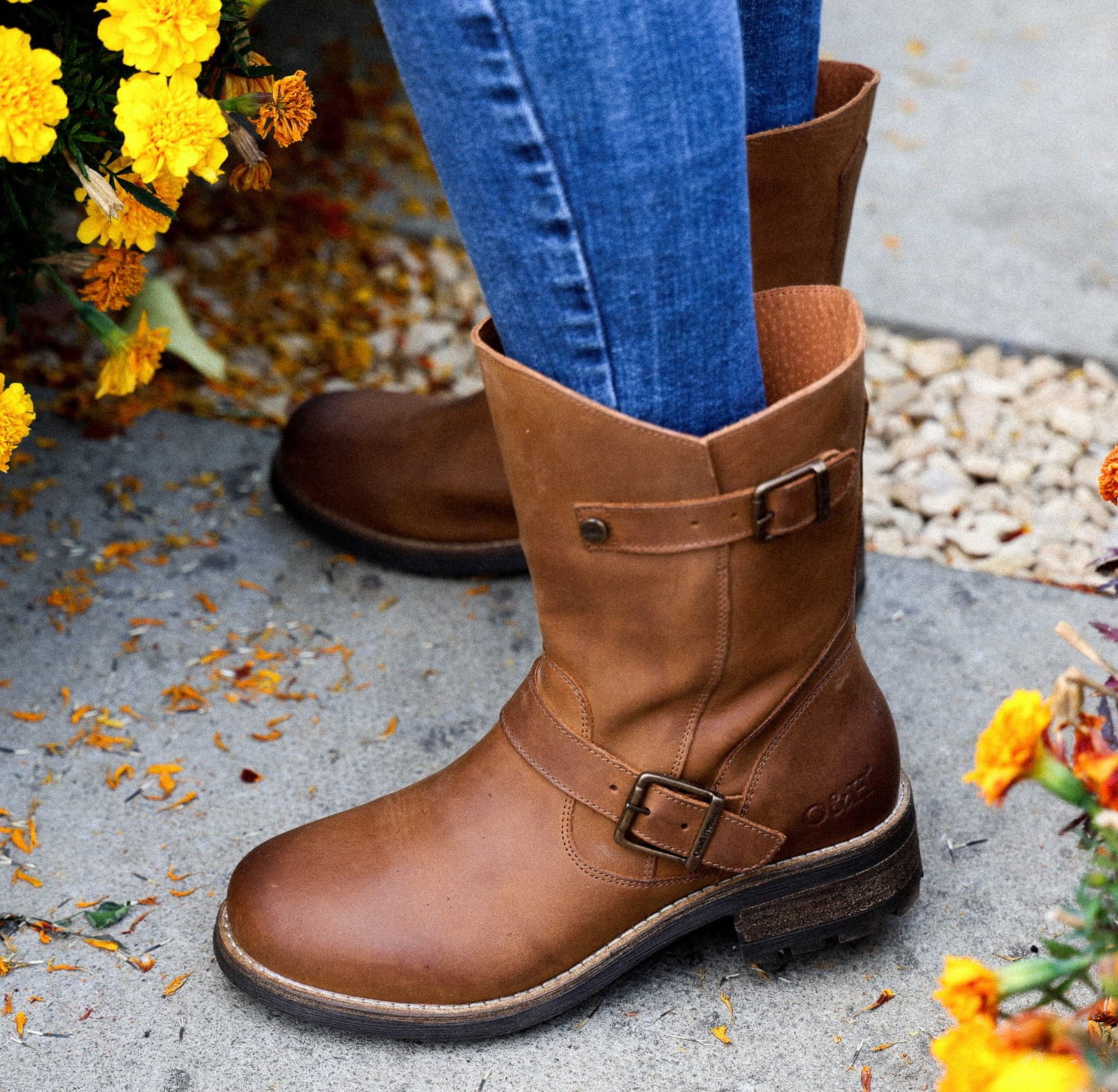 Cognac Crest Demi 2 ankle boots worn outdoors, close view of buckle and leather