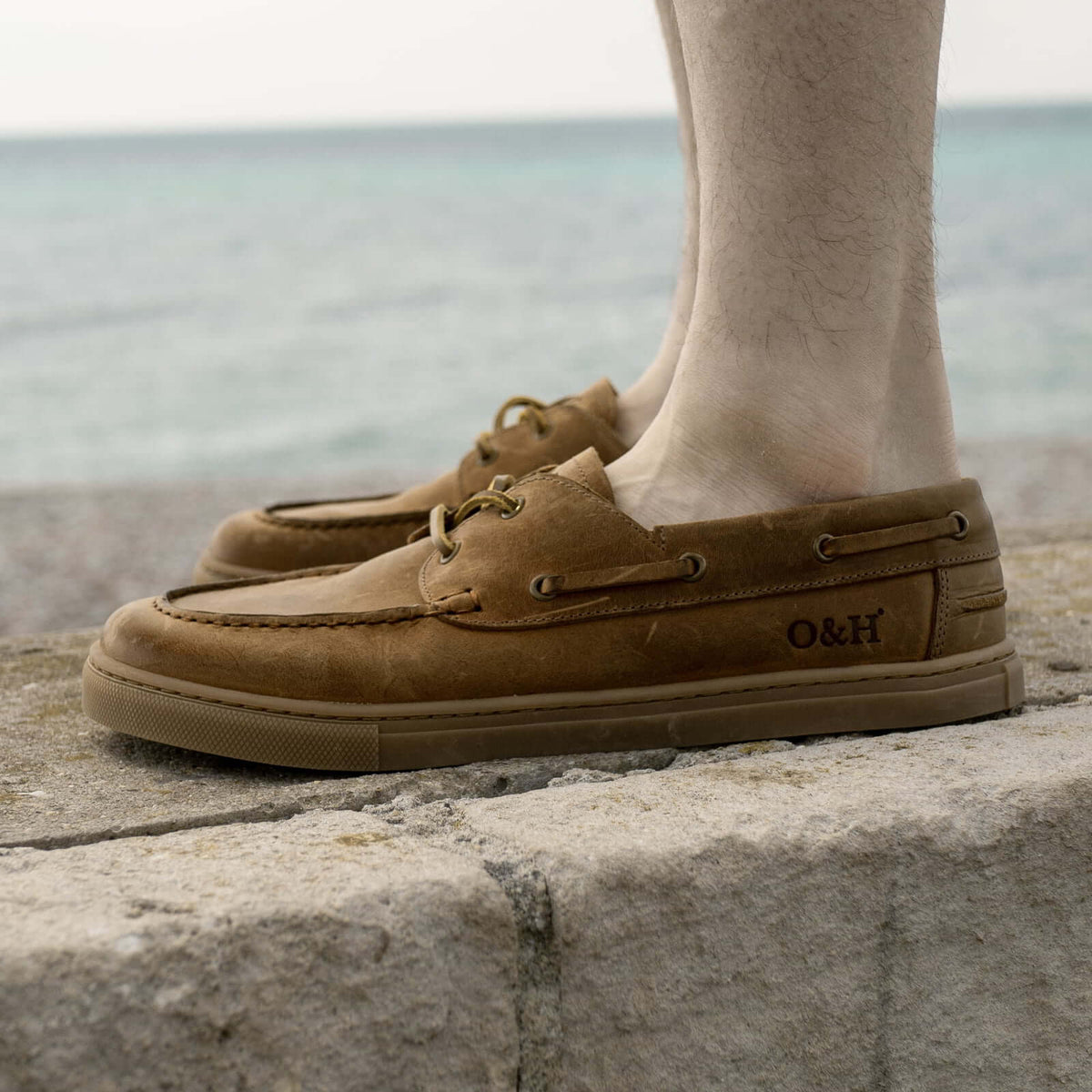 model standing on wall in cypress barefoot shoes in tan