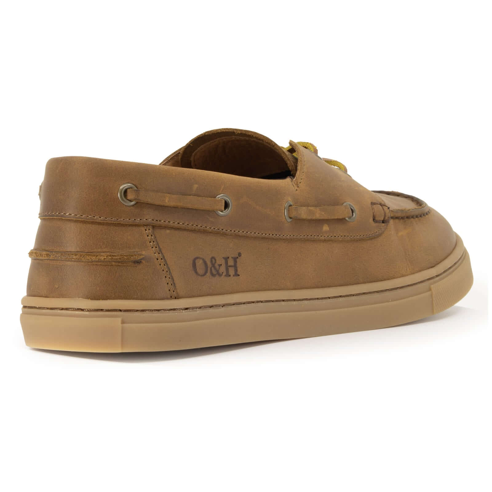 view of O&H logo on heel of tan barefoot shoes on white background