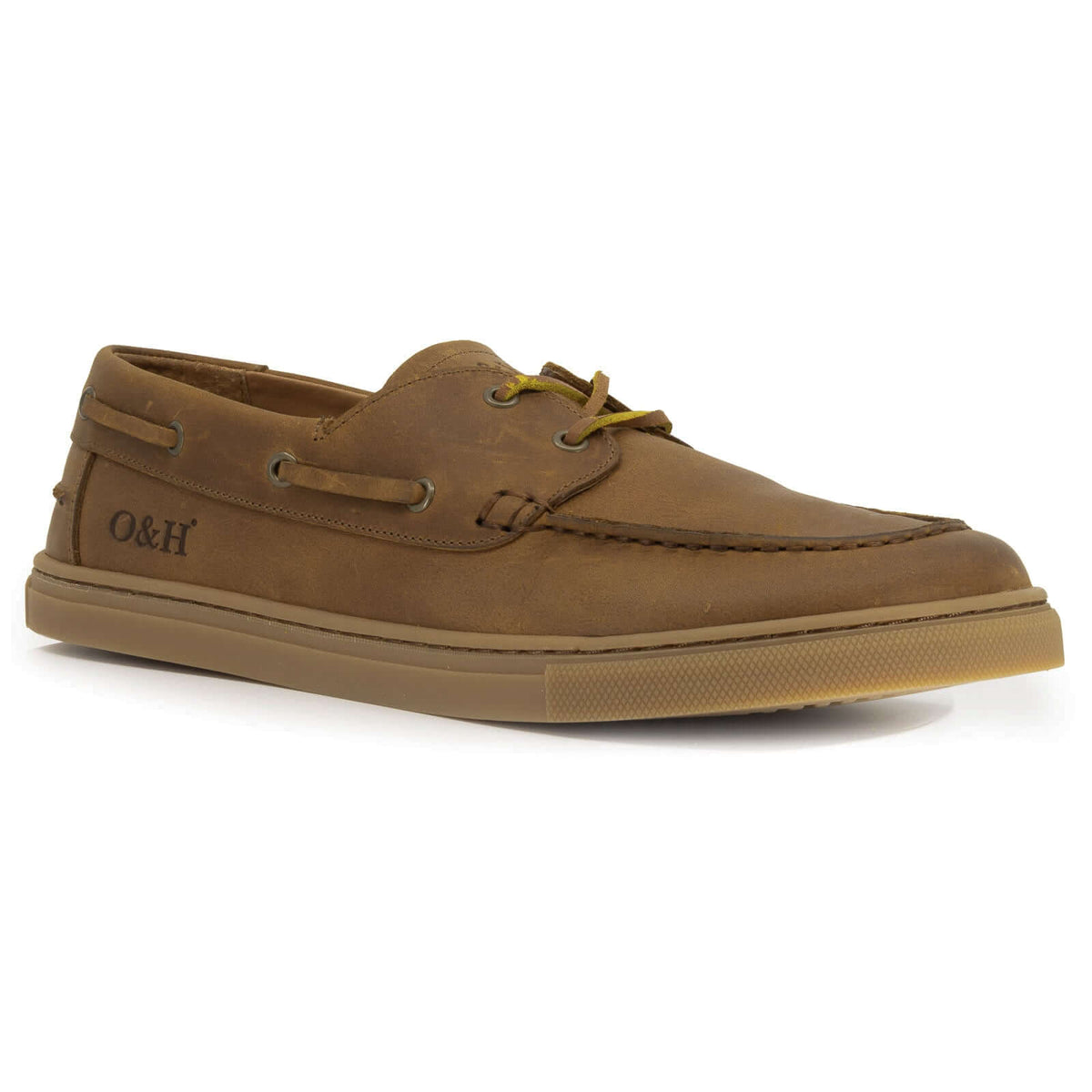 Angled view of tan barefoot shoes with leather laces on white background