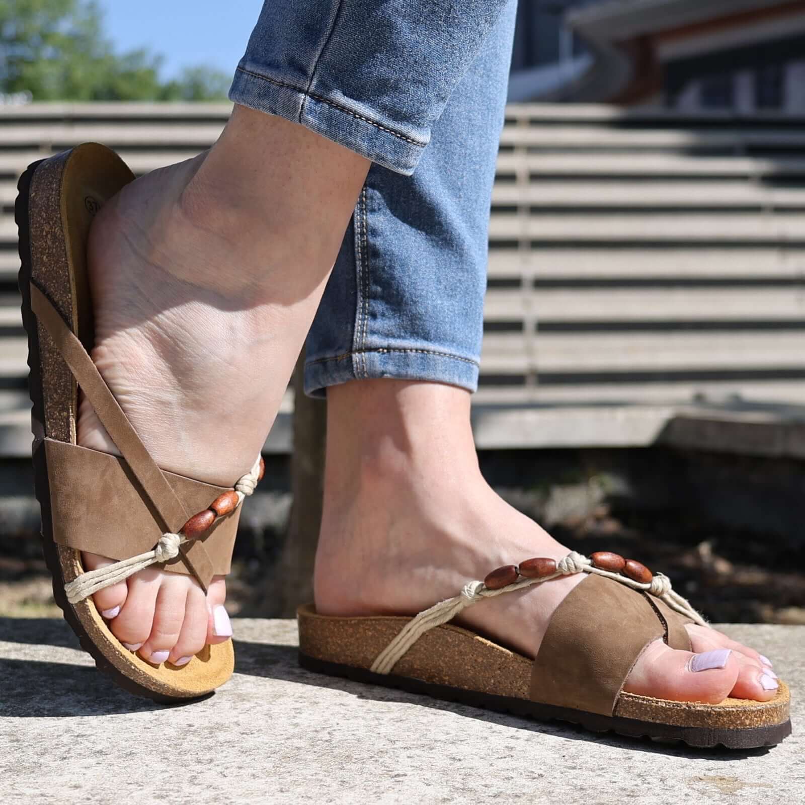 toffee oak & hyde ebony sandals worn outdoors with ankle tie straps and open toe design