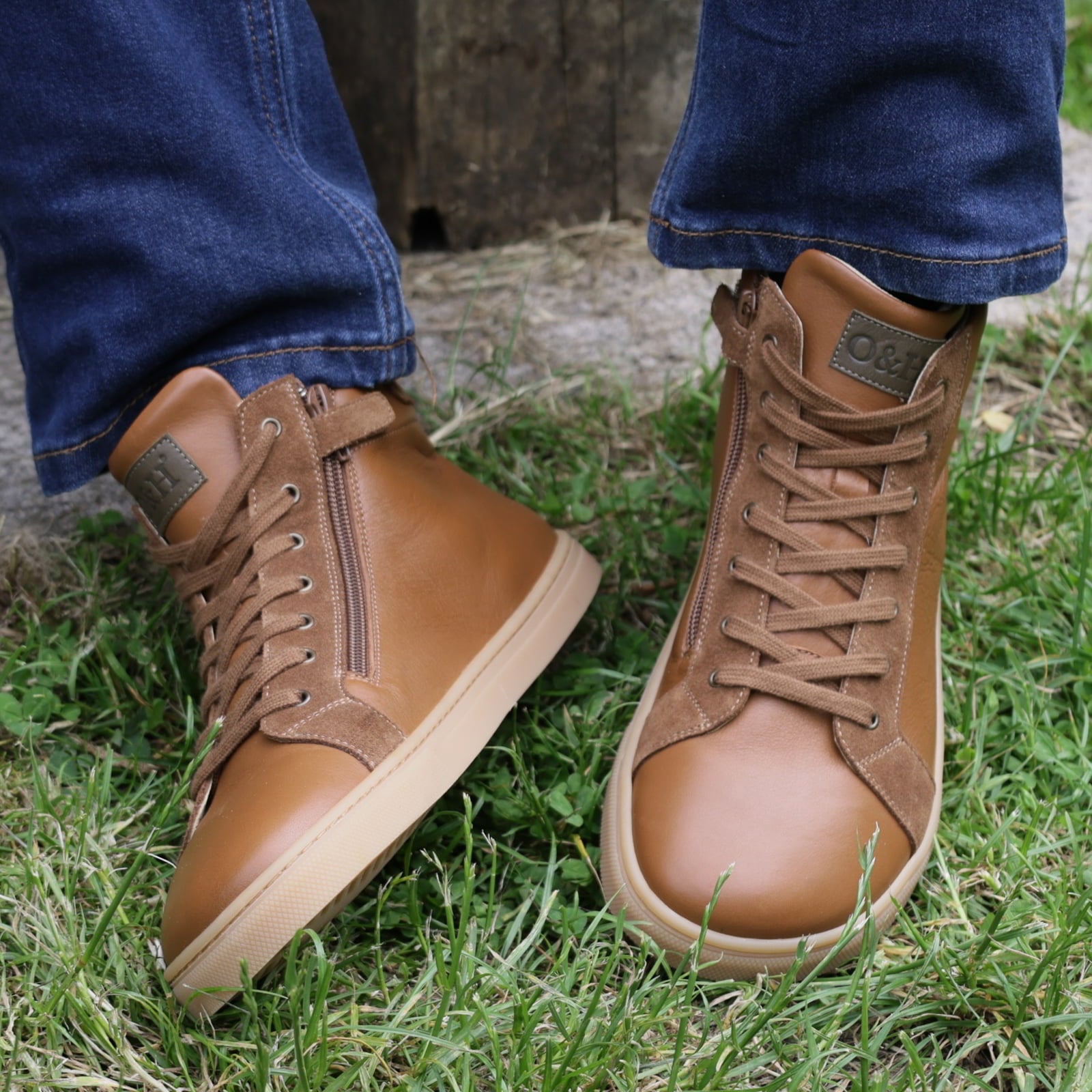 model sat on bench wearing elm barefoot ankle boots in tan