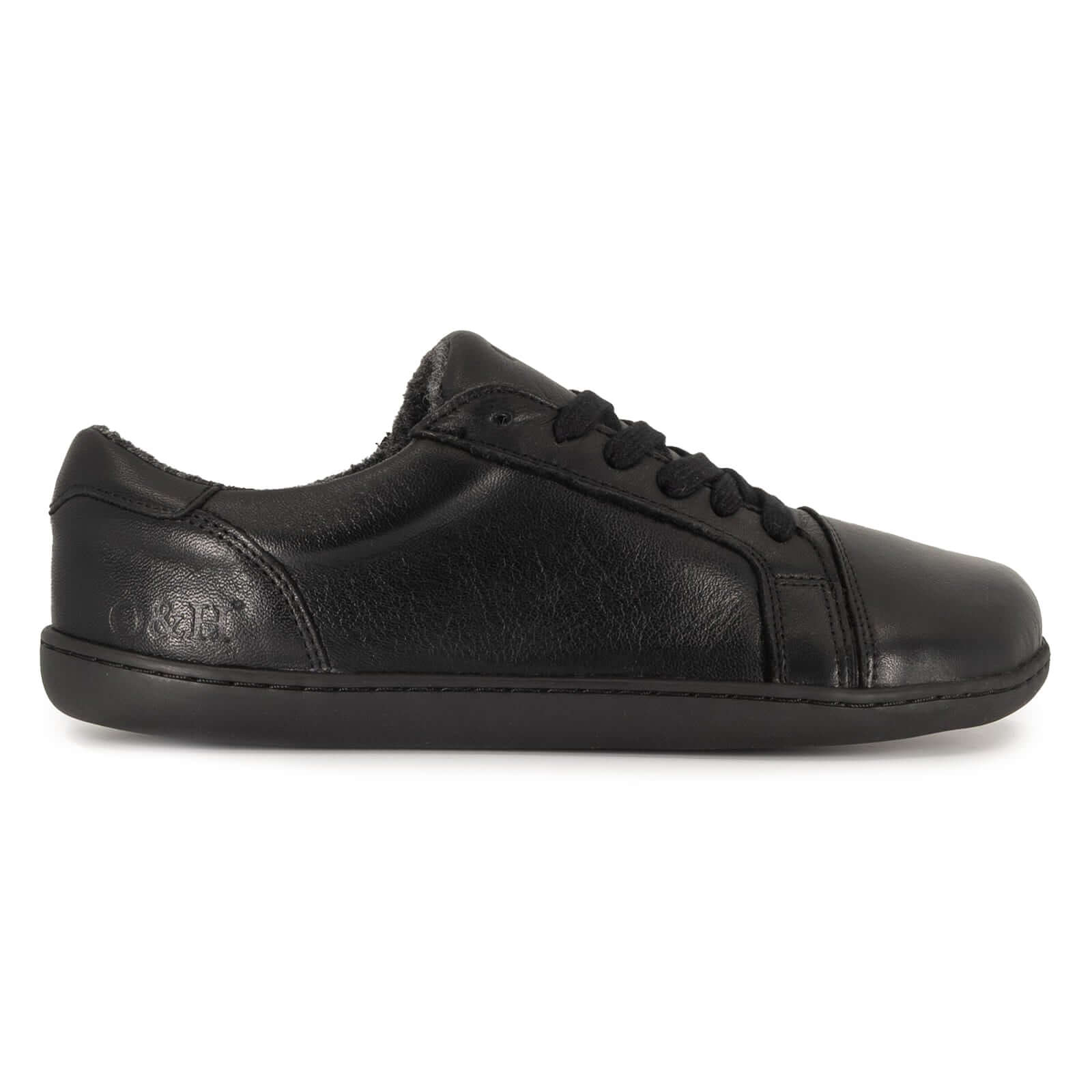 all black barefoot trainers side on angle on white background