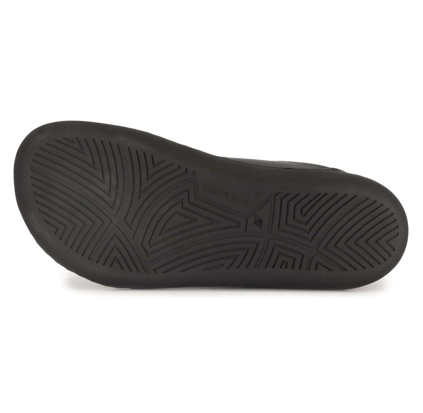 zero drop outsole of black barefoot trainers showing tread pattern