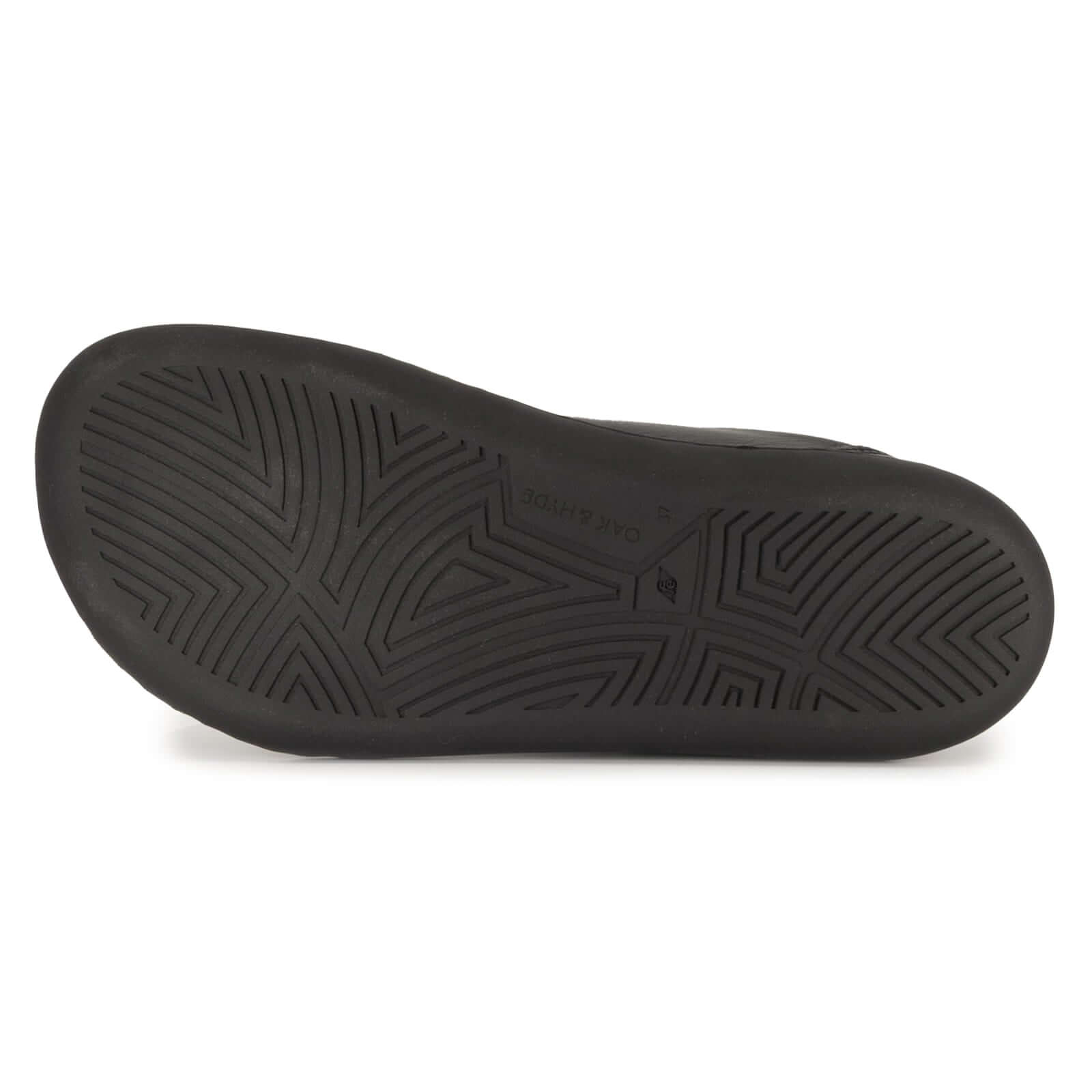 zero drop outsole of black barefoot trainers showing tread pattern
