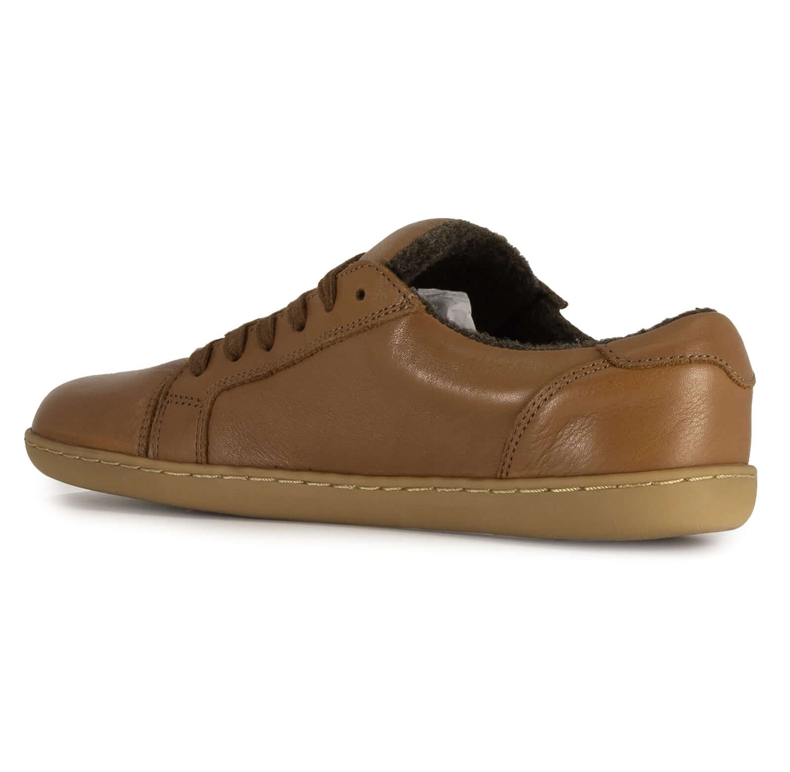 inner side of brown barefoot trainers on white background