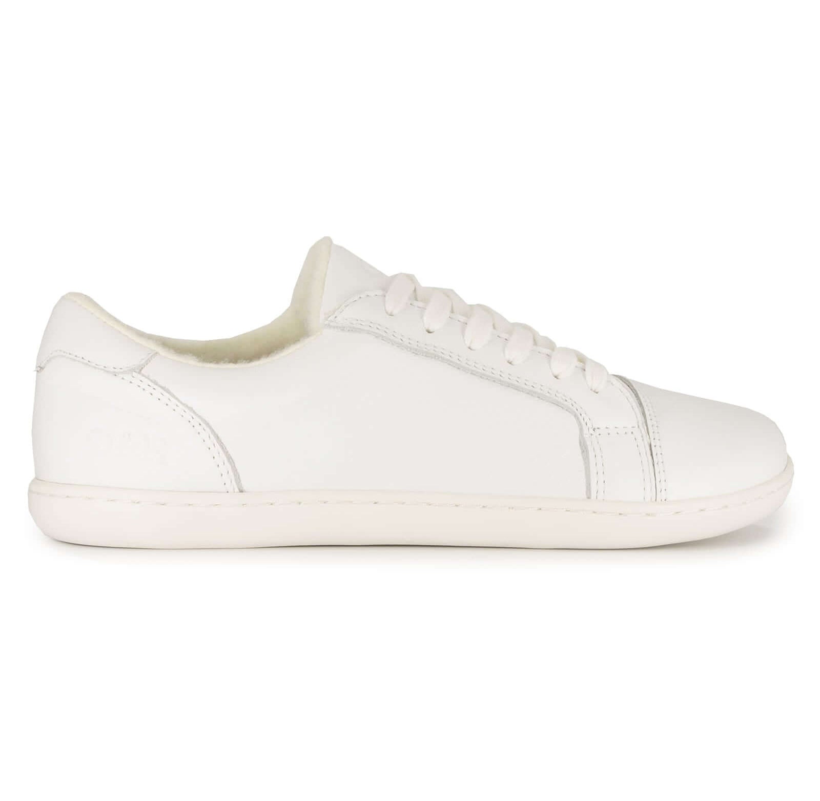 side angle of white barefoot trainers showing panel detailing on white background