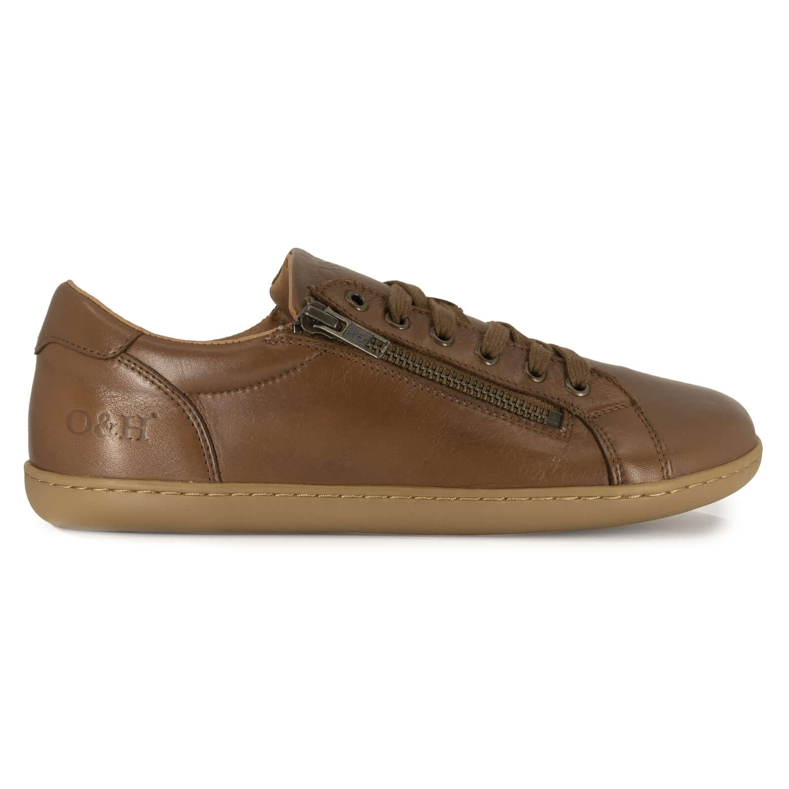 tan leather barefoot trainers from the side showing logo on white background