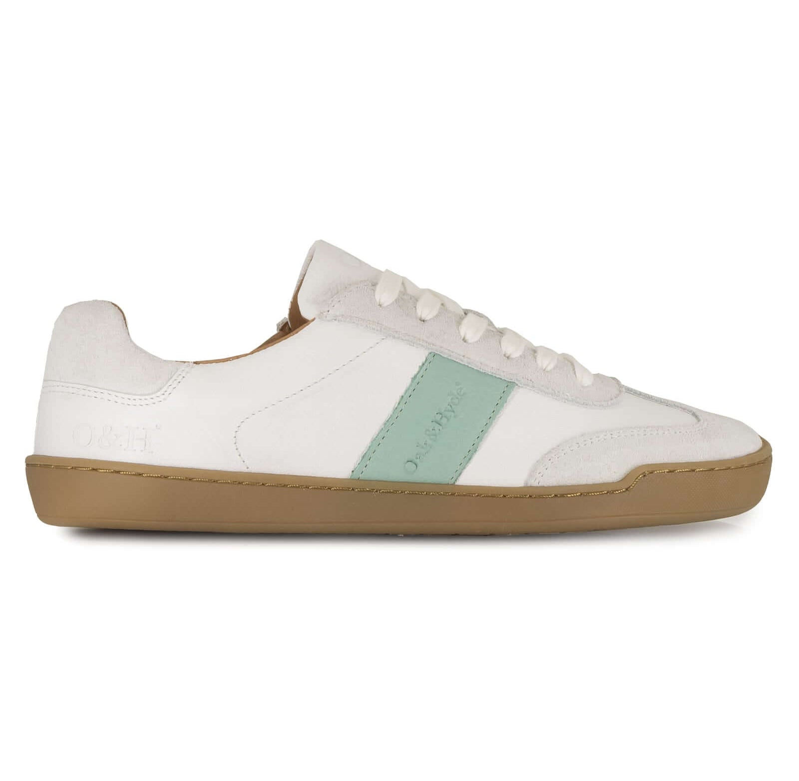 White barefoot trainer with a green accent on a white background