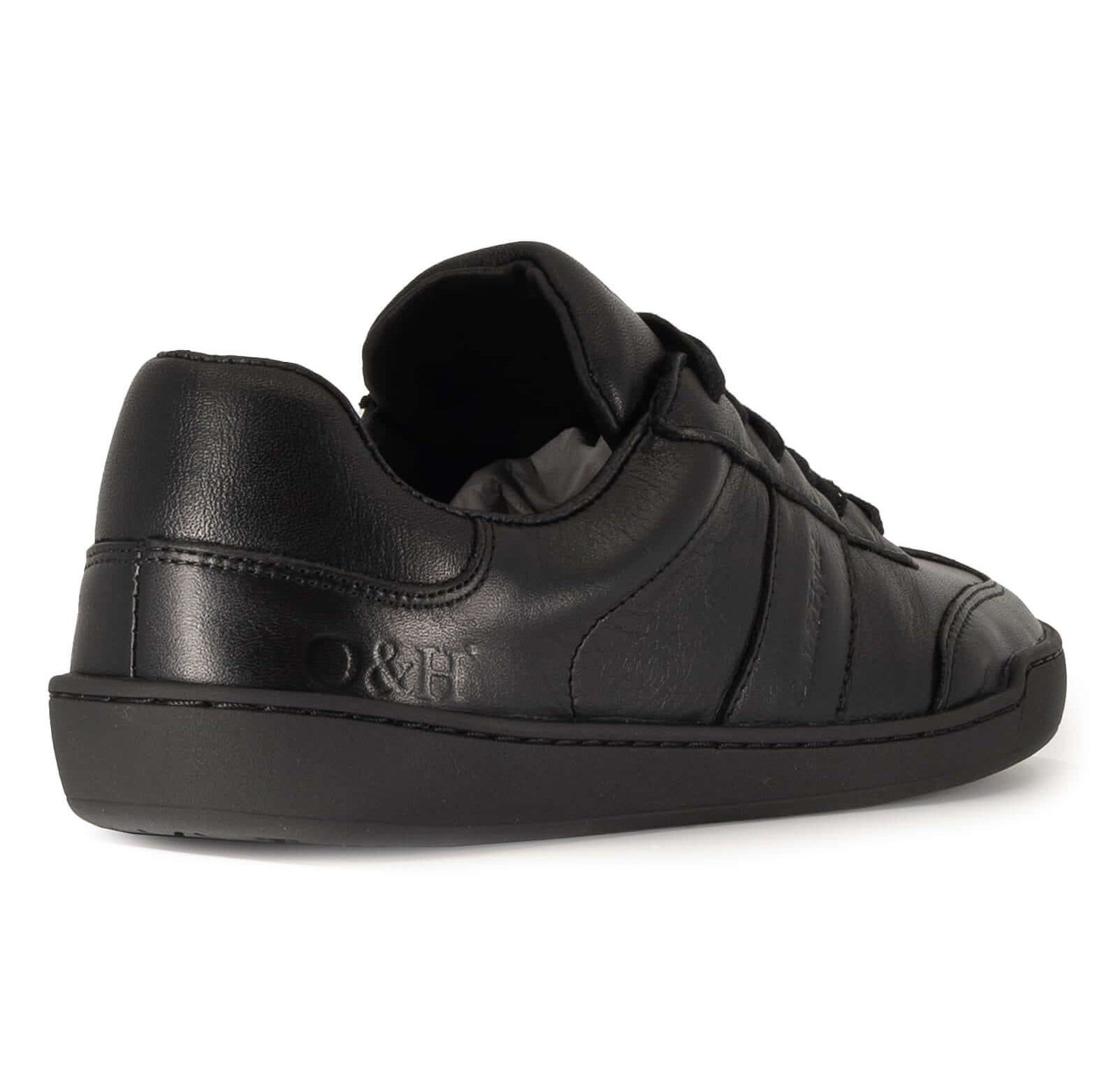 black leather barefoot shoe showing O&H logo on heel on white background