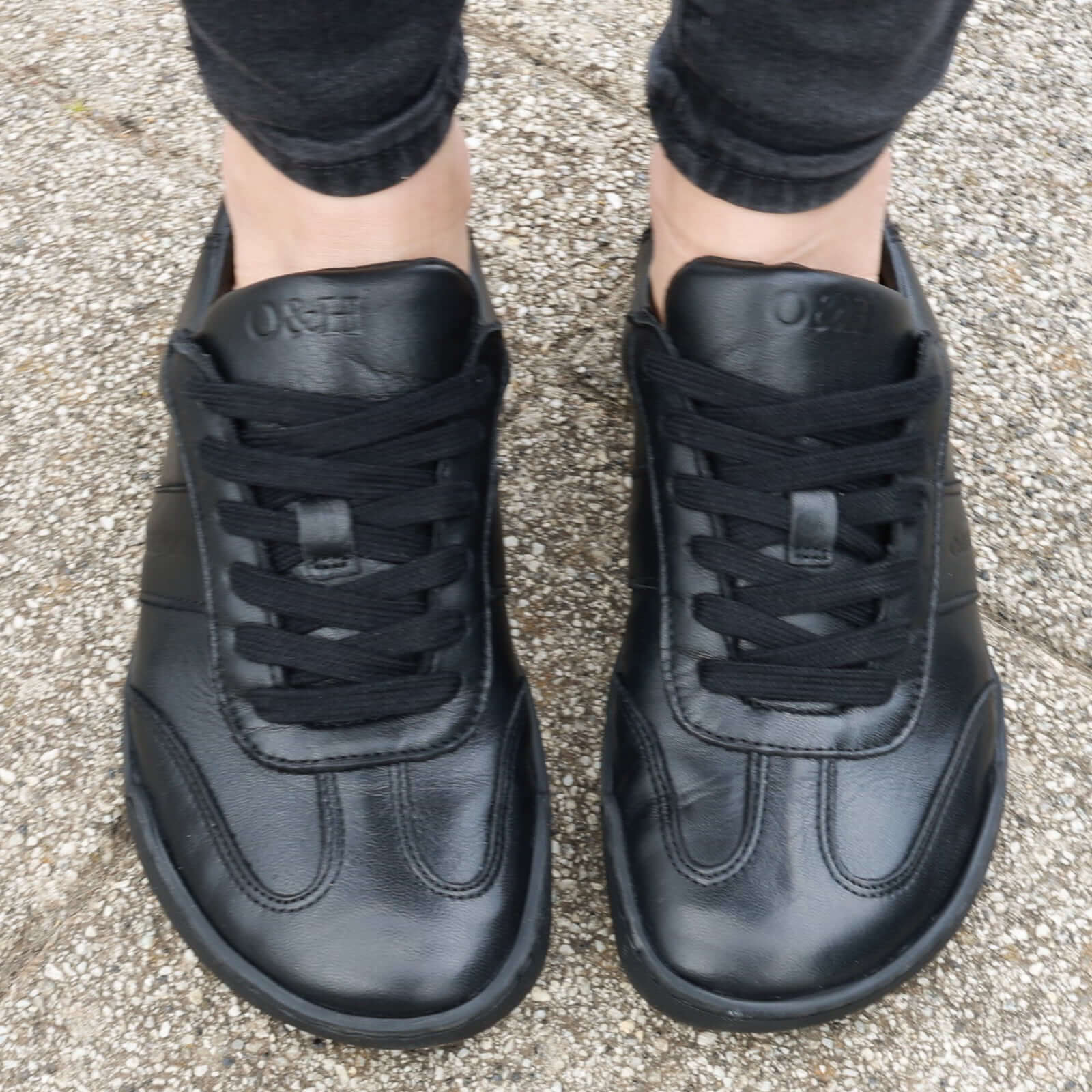 model wearing juniper all black trainers birds eye view showing toe box shape