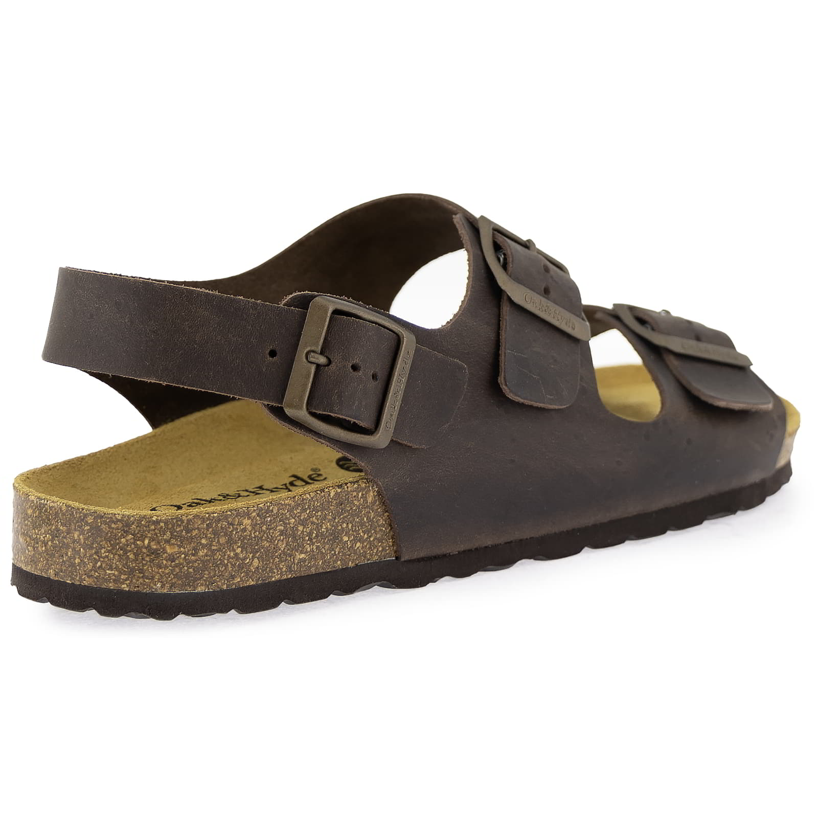 Rear three-quarter view of dark brown leather fisherman sandal showing heel strap and cork footbed