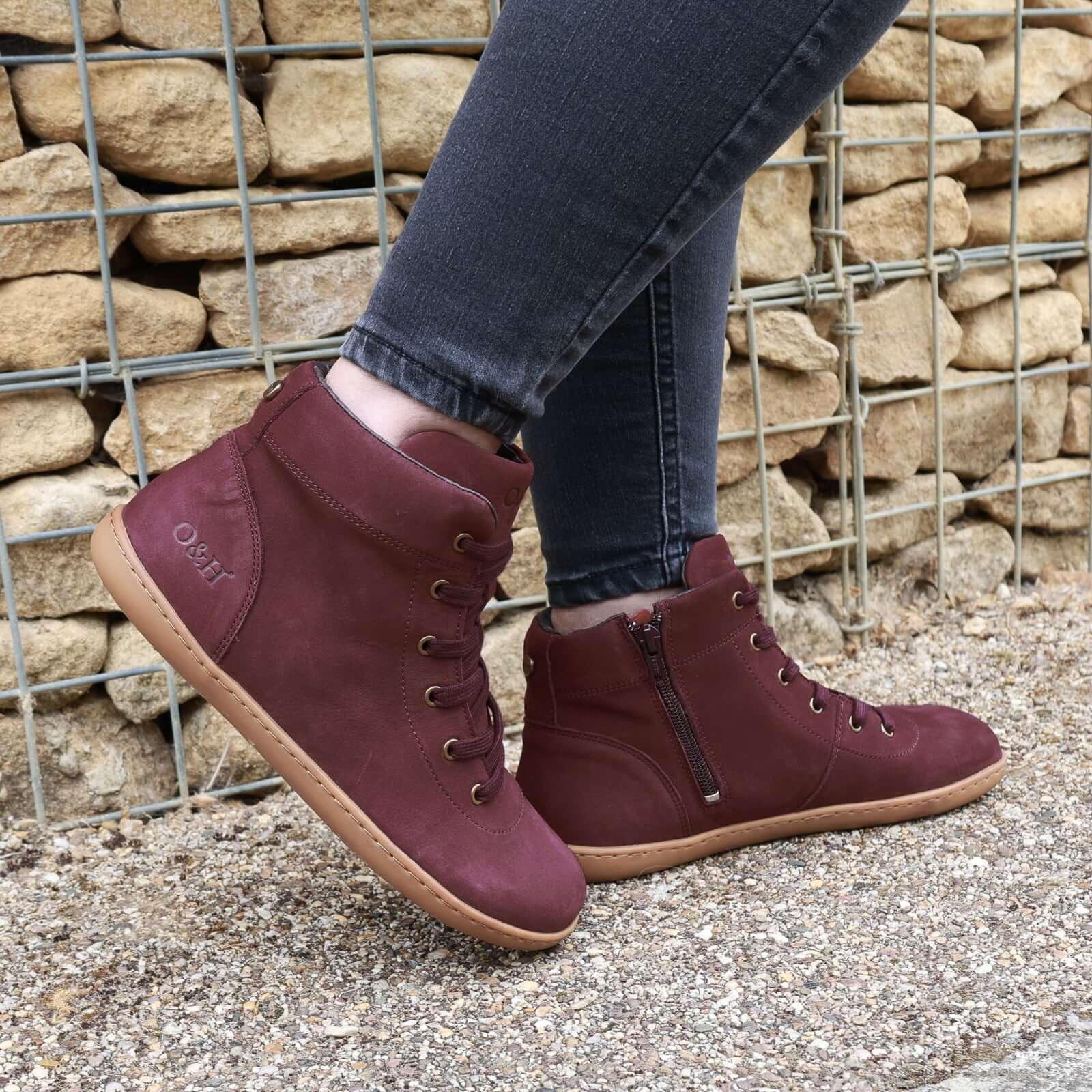 model standing outdoors wearing mulberry barefoot ankle boots in wine
