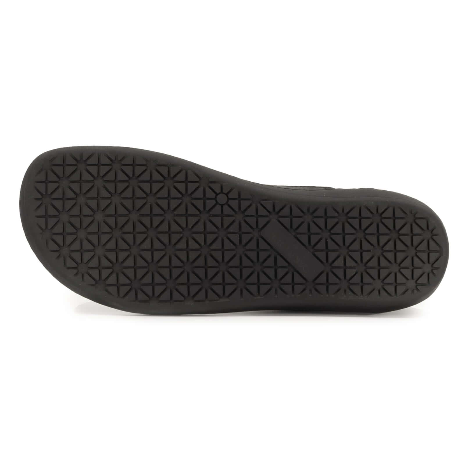 black zero drop outsole of spruce barefoot chukka boots in black showing tread pattern
