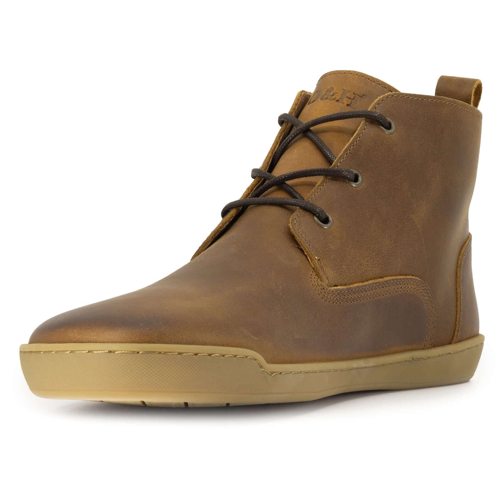 front angle view of spruce barefoot boots showing branding on tongue