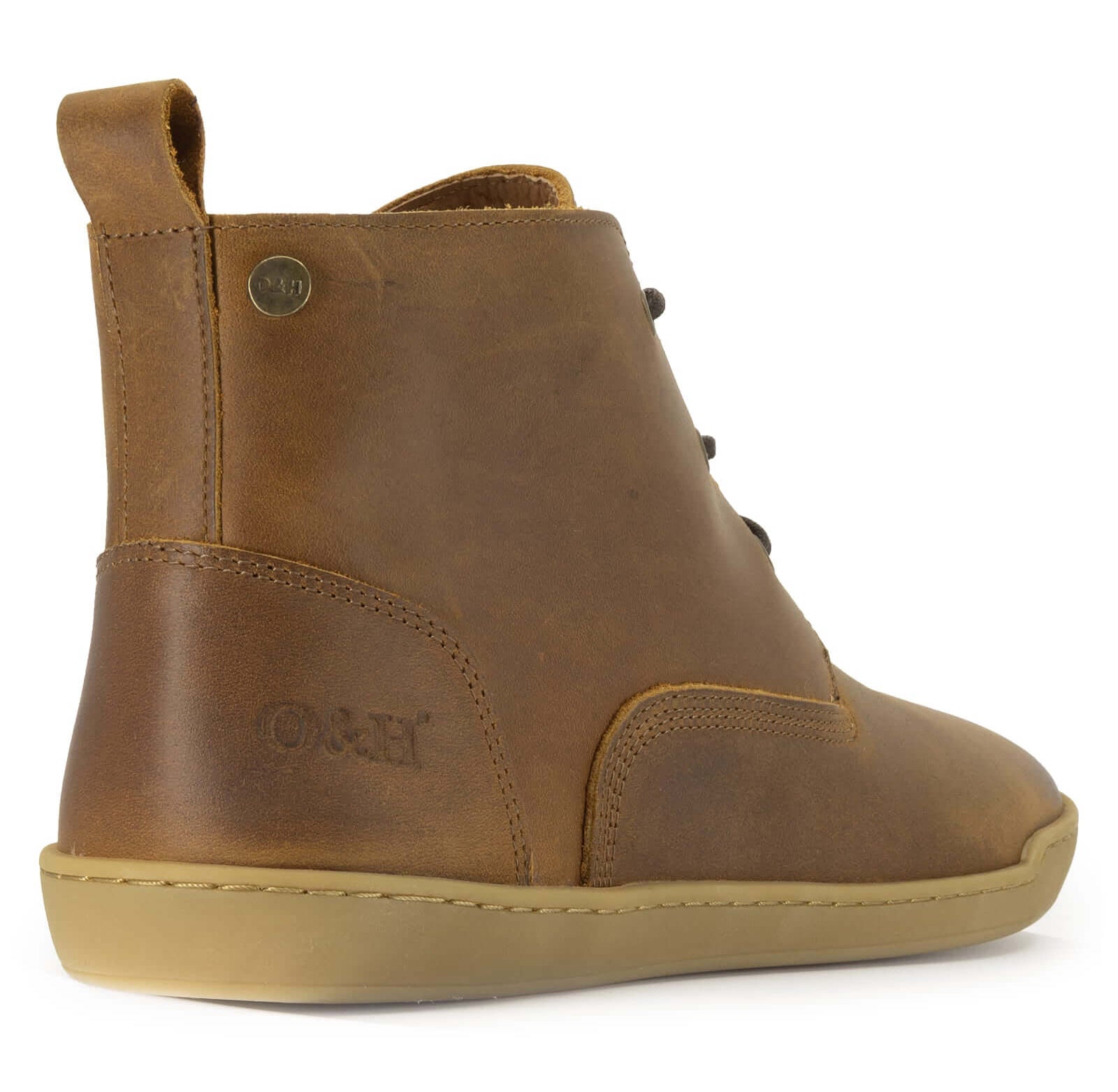 view of heel of spruce barefoot boots in tan highlighting heel pull loop