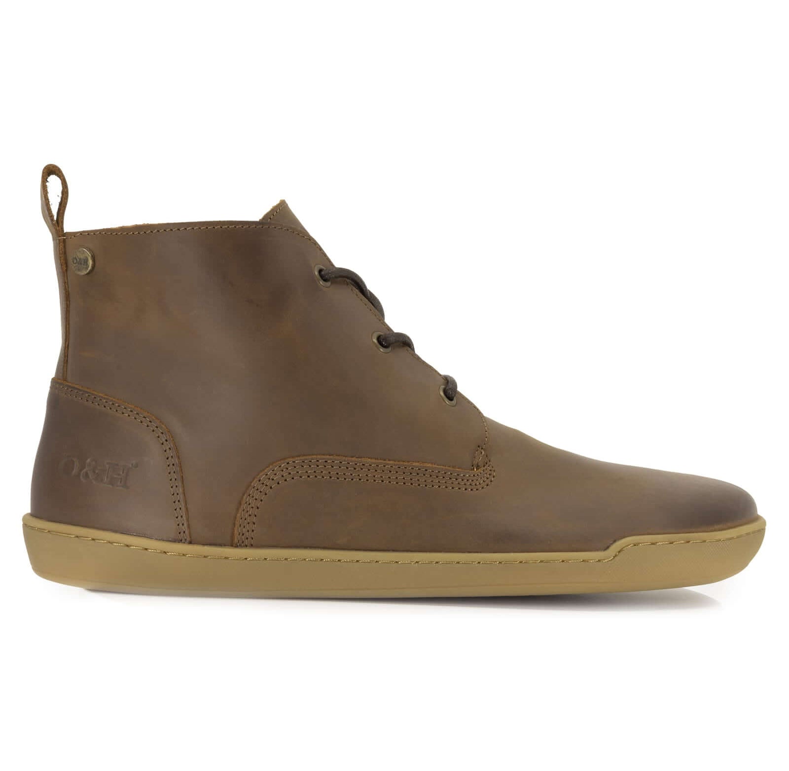 side profile of spruce barefoot boots in brown showing heel logo on white background