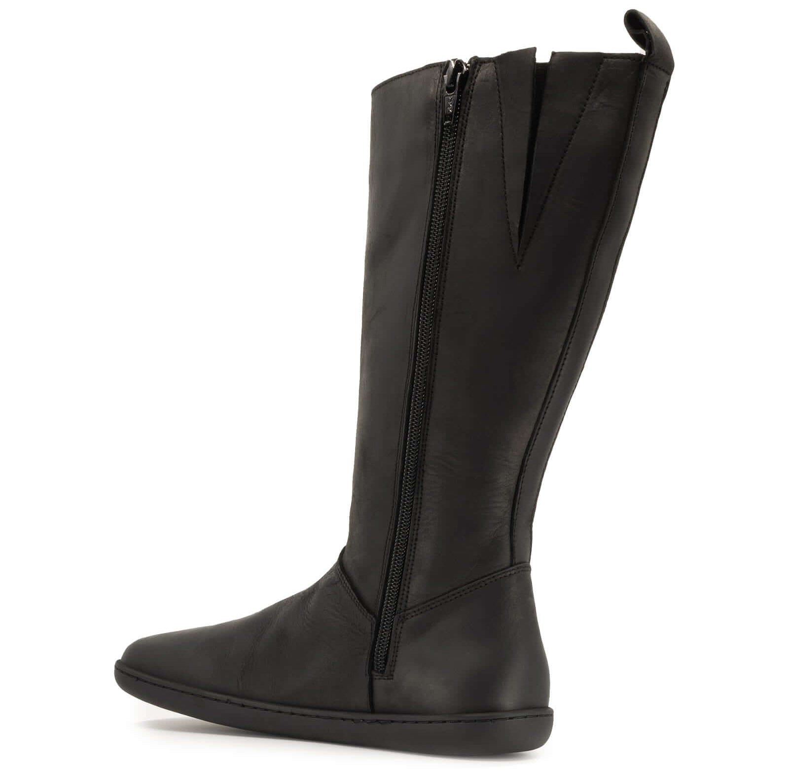 inside zip view of black barefoot boots on white background