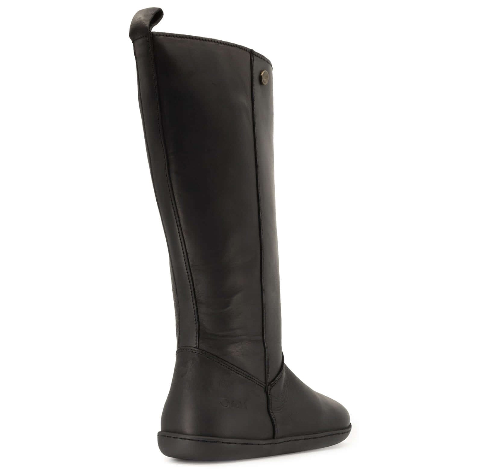 rear view of heel of black barefoot boots on white background