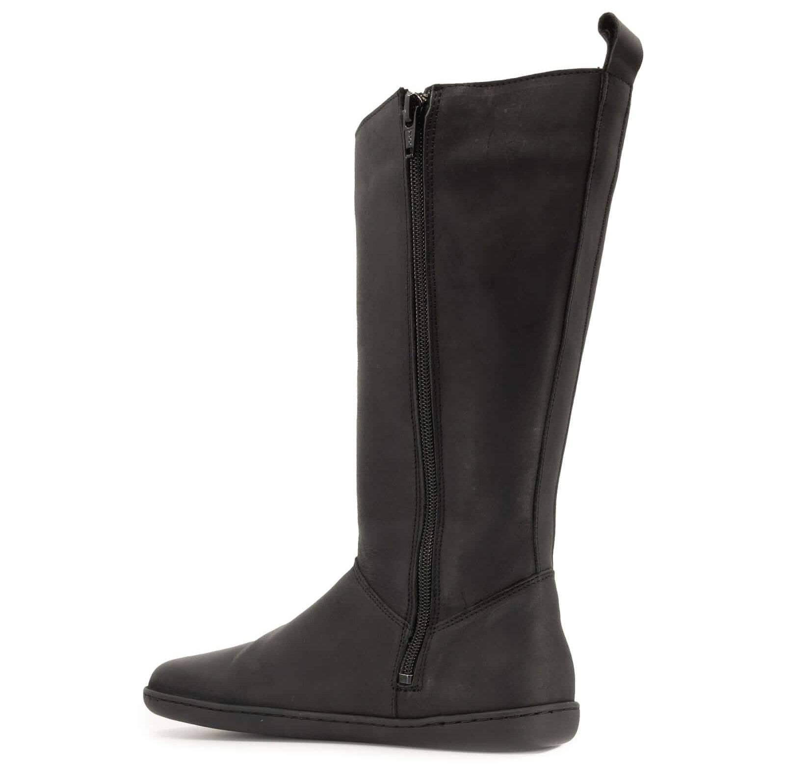 inside zip on black barefoot boots showing pull tab on white background