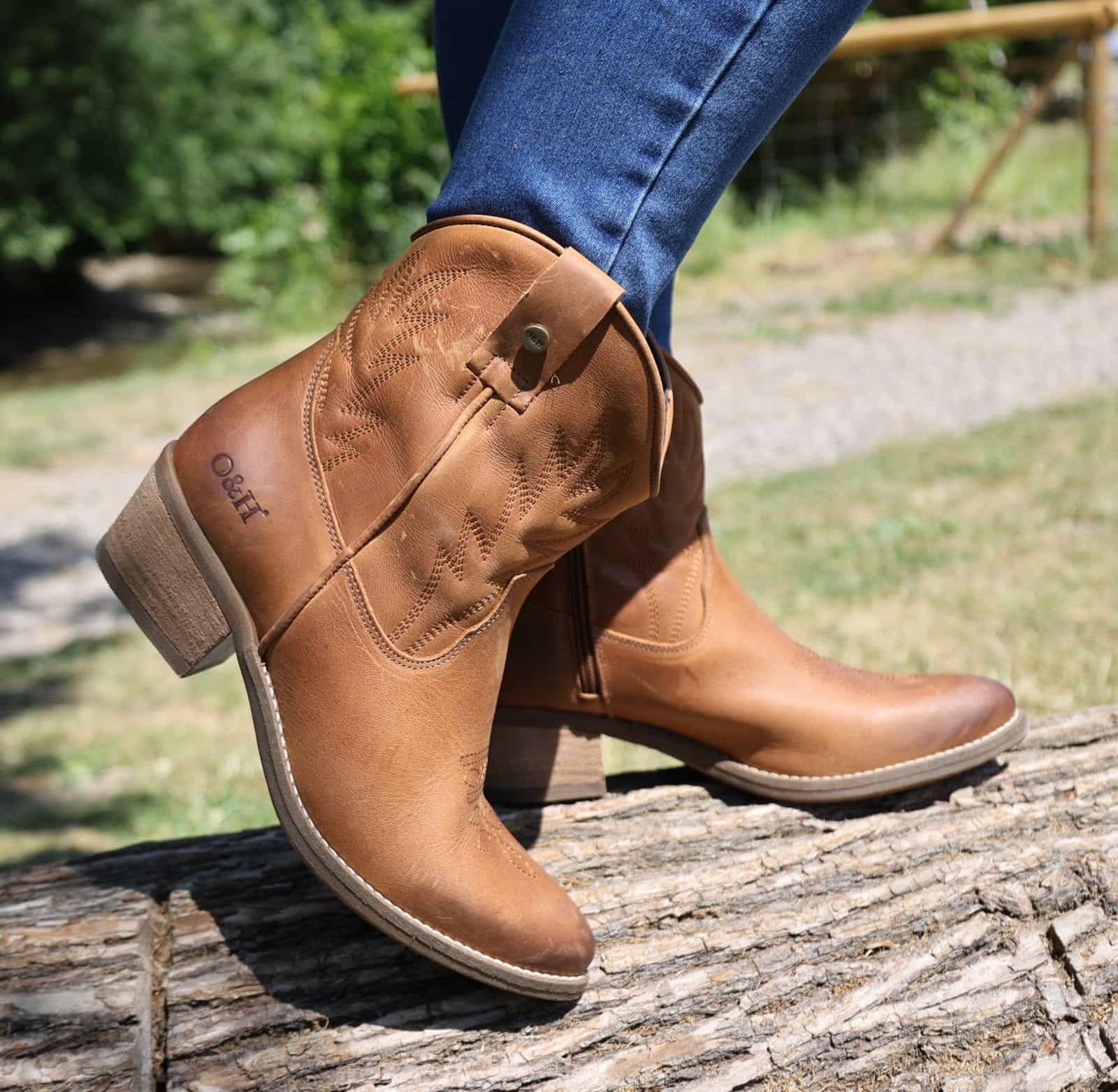 lifestyle image of model wearing the Texan Ankle boot in tan