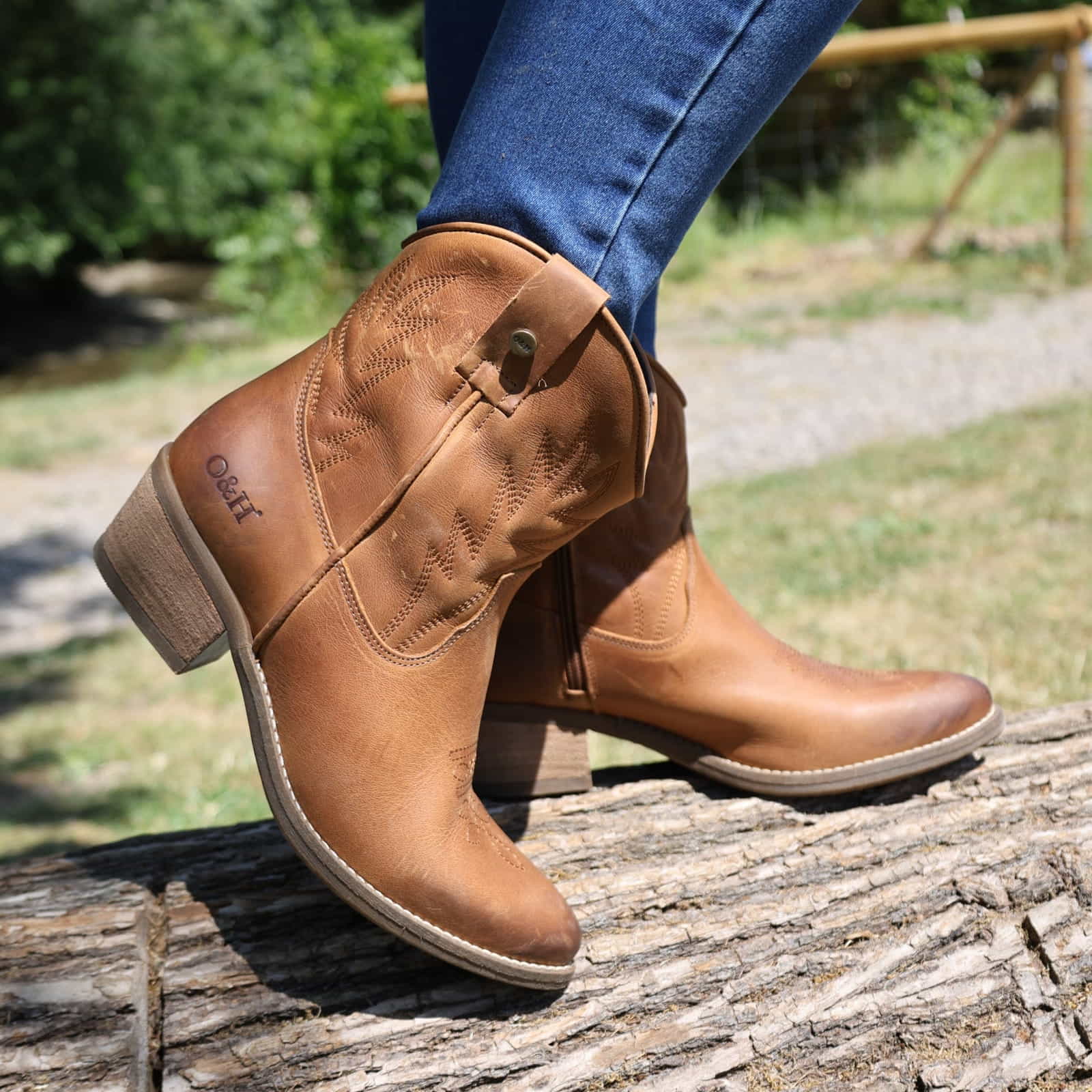 lifestyle image of model wearing the Texan Ankle boot in tan
