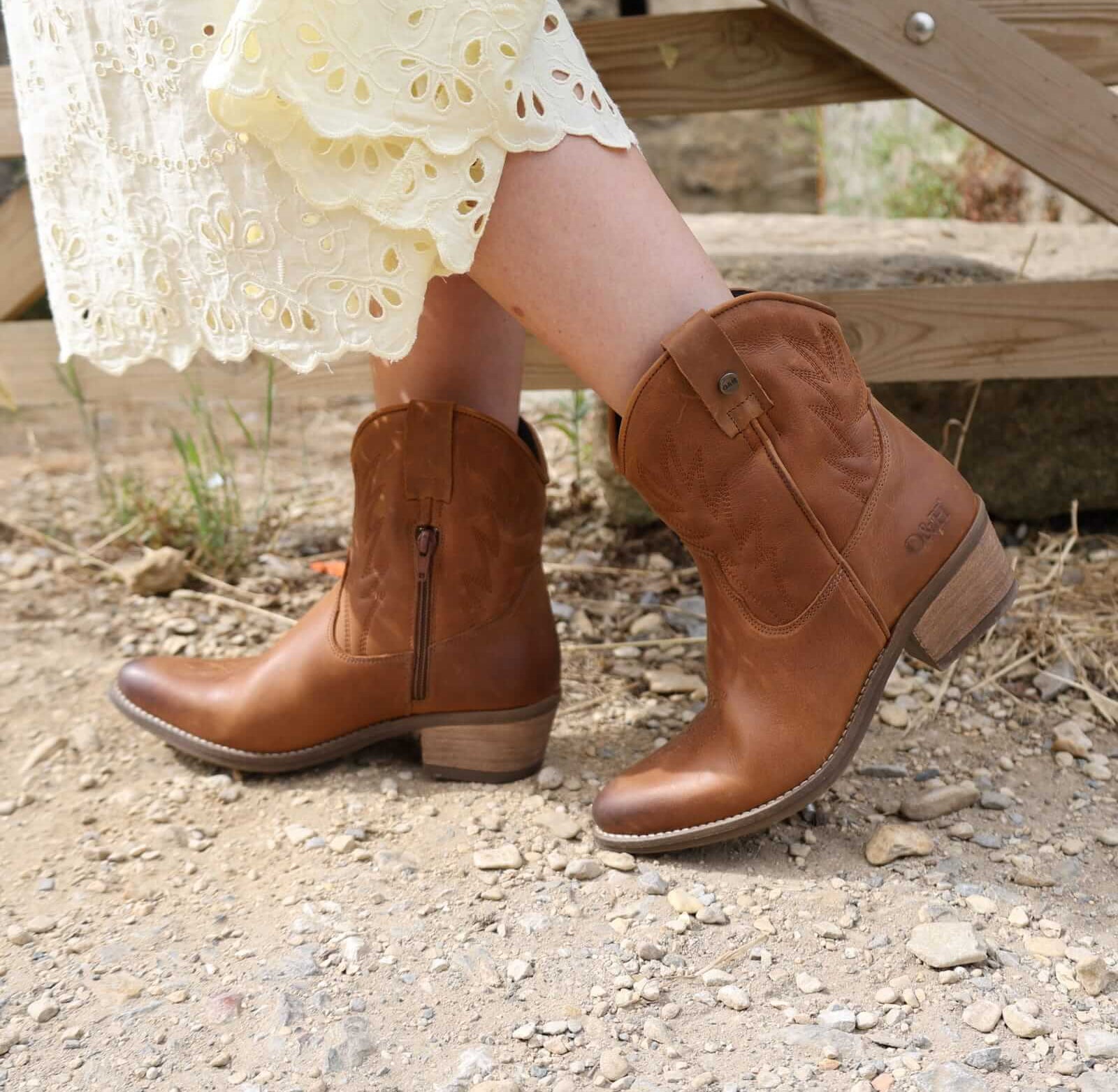 second lifestyle image of model wearing the Texan Ankle boot in tan