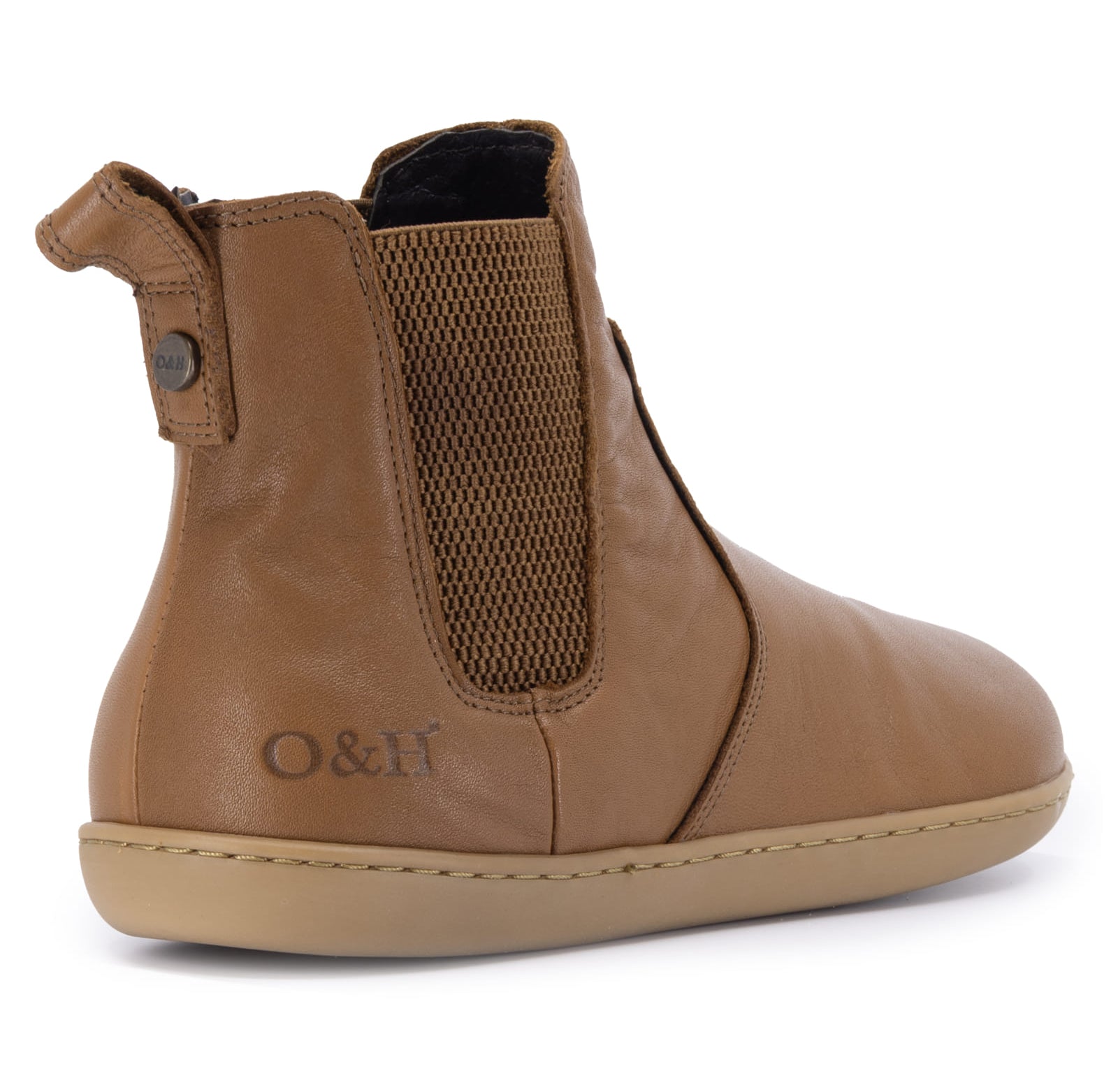 tan leather barefoot chelsea boots on a white background from the back of the boot