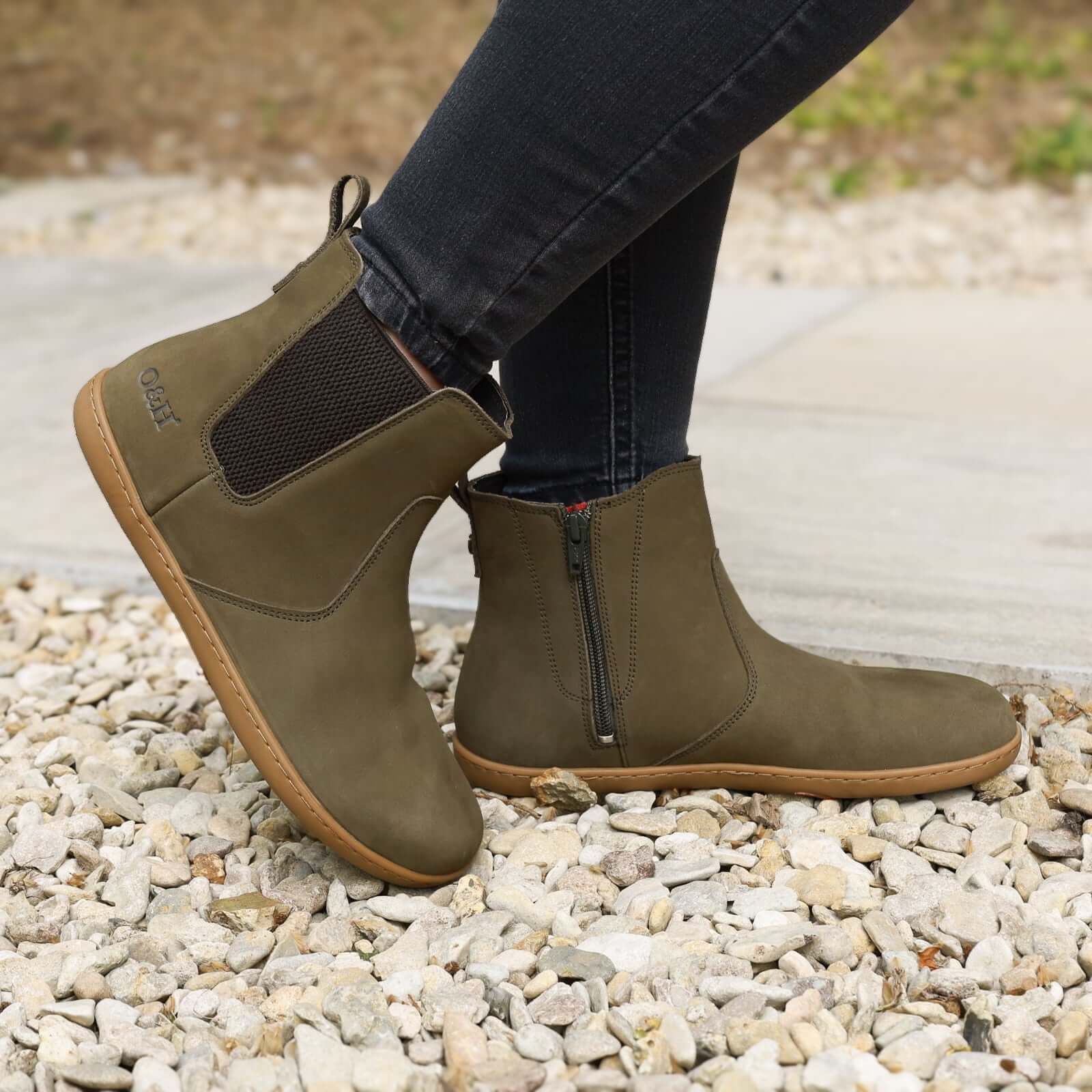 model standing outdoors in willow zip in khaki barefoot chelsea boots