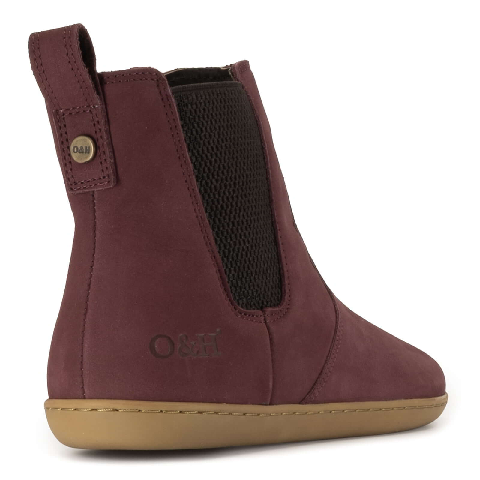view of heel of willow zip barefoot boots showing O&H branding and branded brass pin