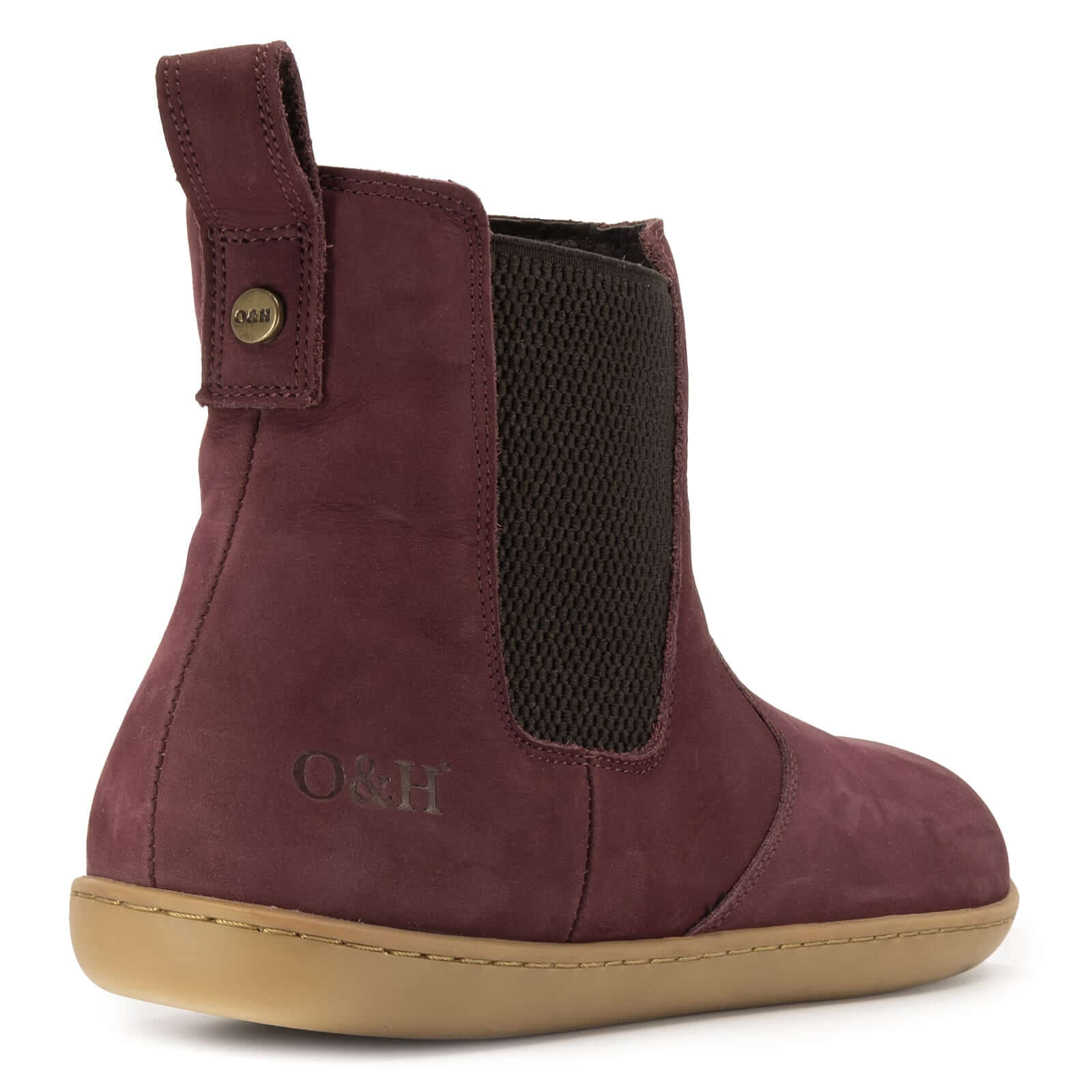 view of heel of willow zip barefoot boots showing O&H branding and branded brass pin