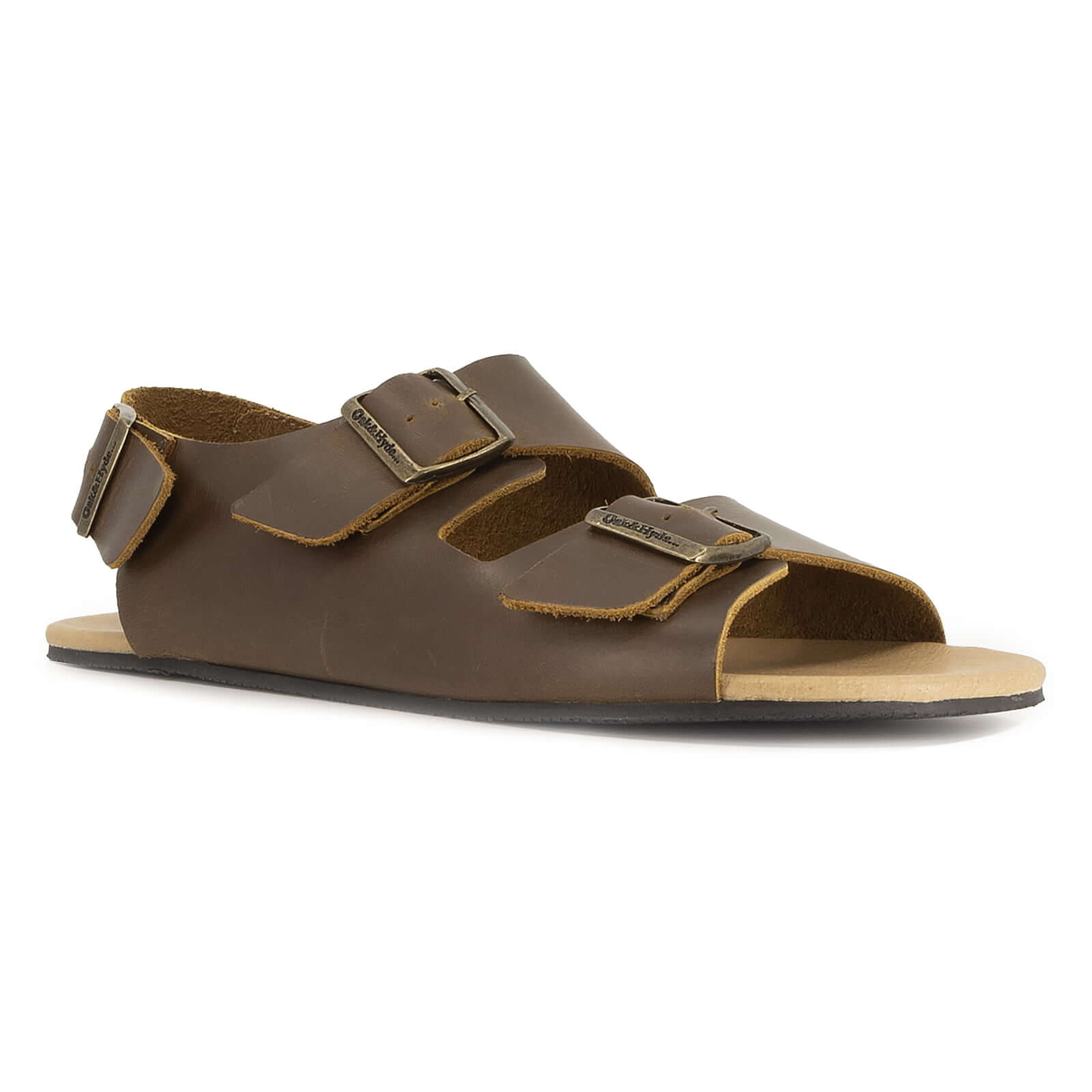 angled front view of brown oak & hyde wisteria barefoot sandals showing wide toe shape and adjustable strap fastening