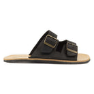 side profile view of acacia barefoot sandals in black showing upper detail and buckle fastening