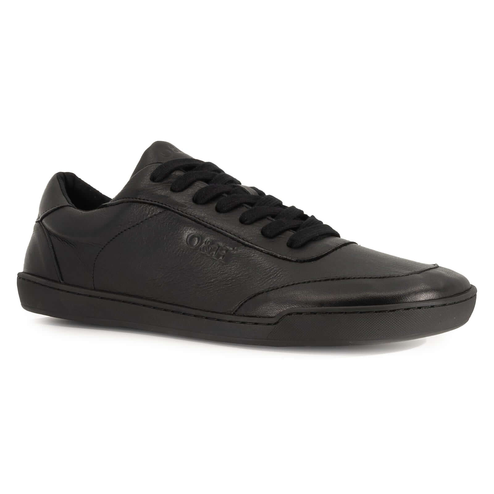 angled view of aspen all black leather barefoot trainers showing laces and branding