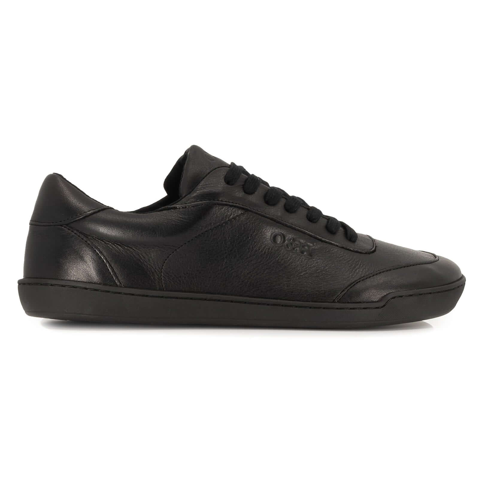 side profile view of all black leather barefoot trainers showing leather upper